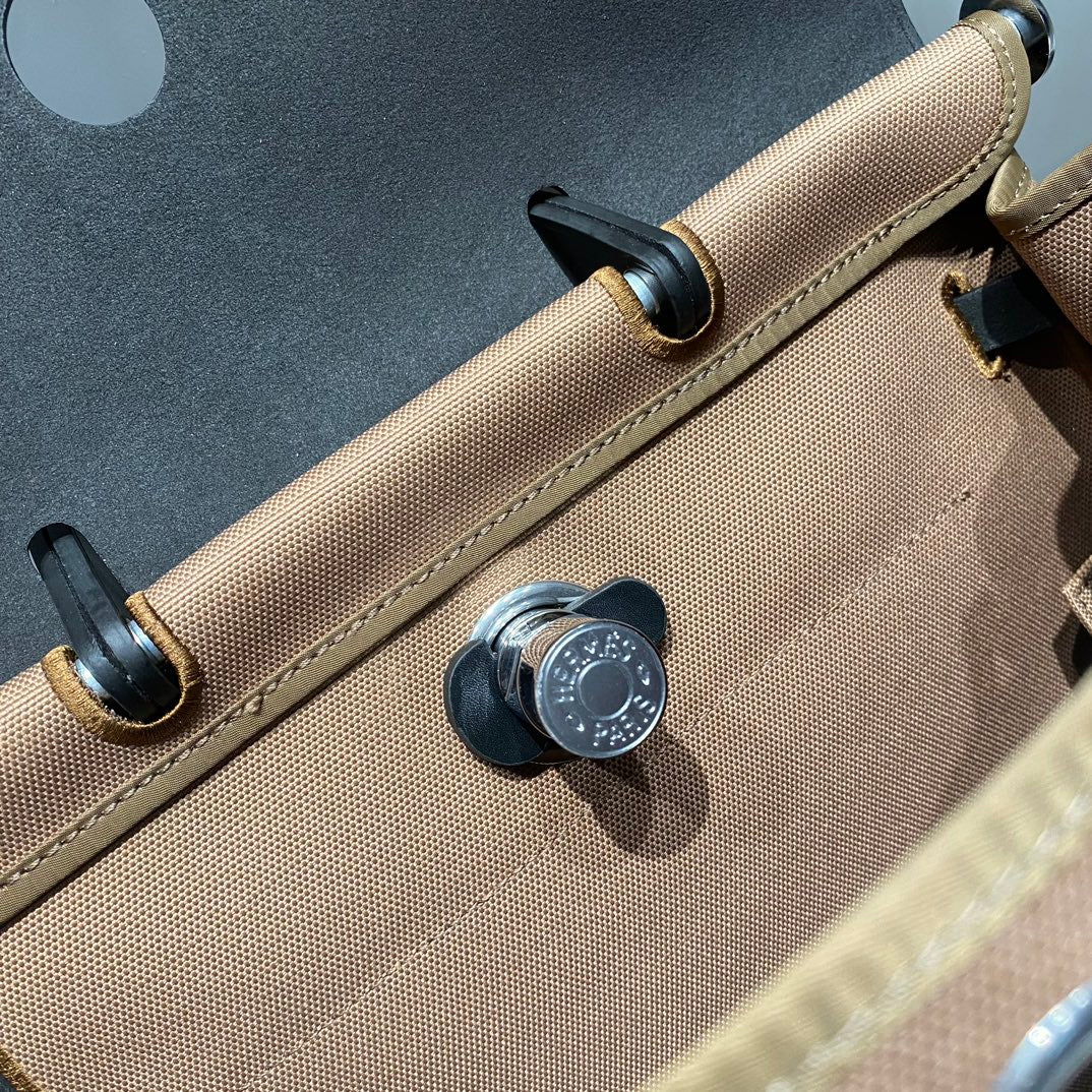HERMES HERBAG A DOS ZIP RETOURNE BACKPACK 29 IN BROWN CANVAS AND BLACK CALFSKIN