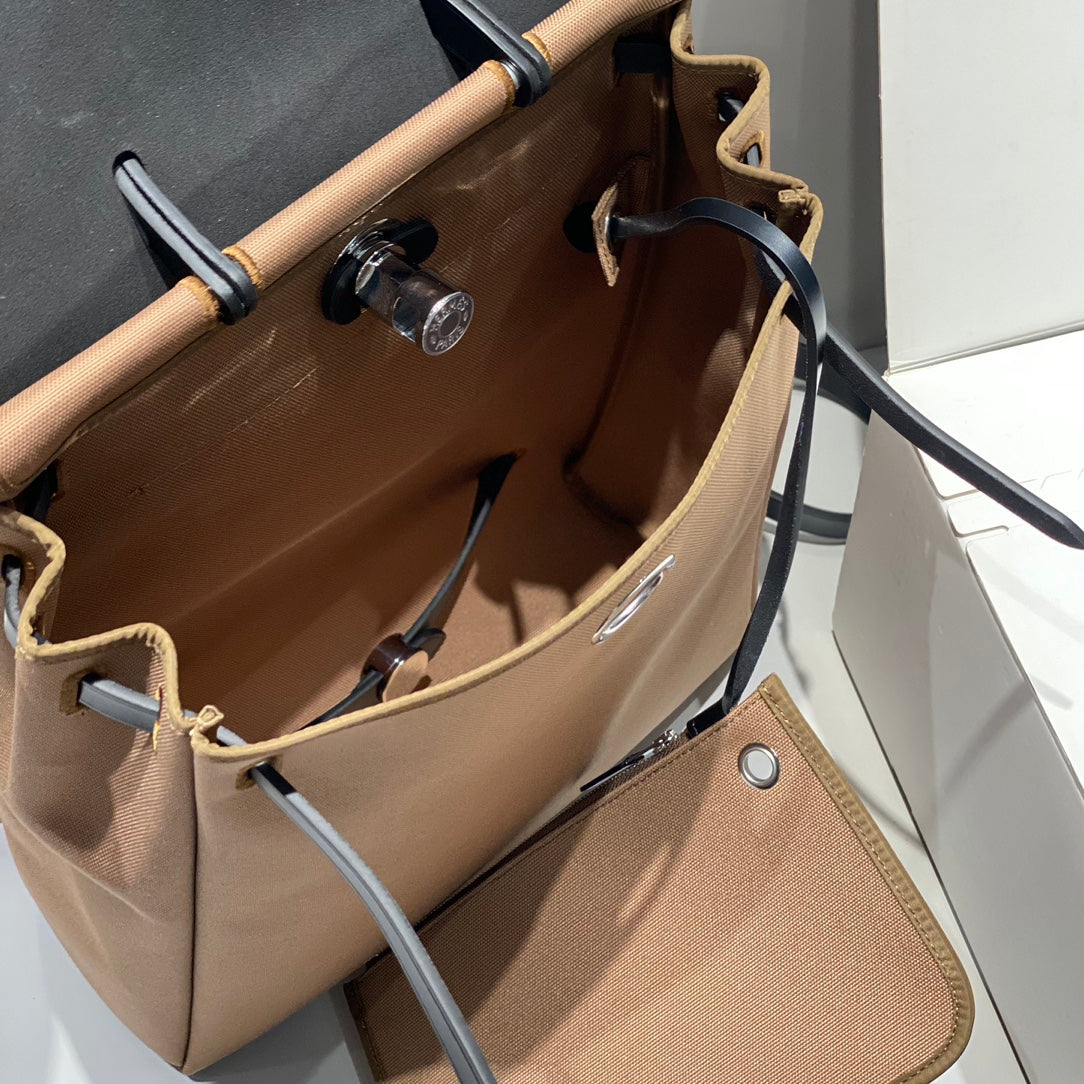 HERMES HERBAG A DOS ZIP RETOURNE BACKPACK 29 IN BROWN CANVAS AND BLACK CALFSKIN