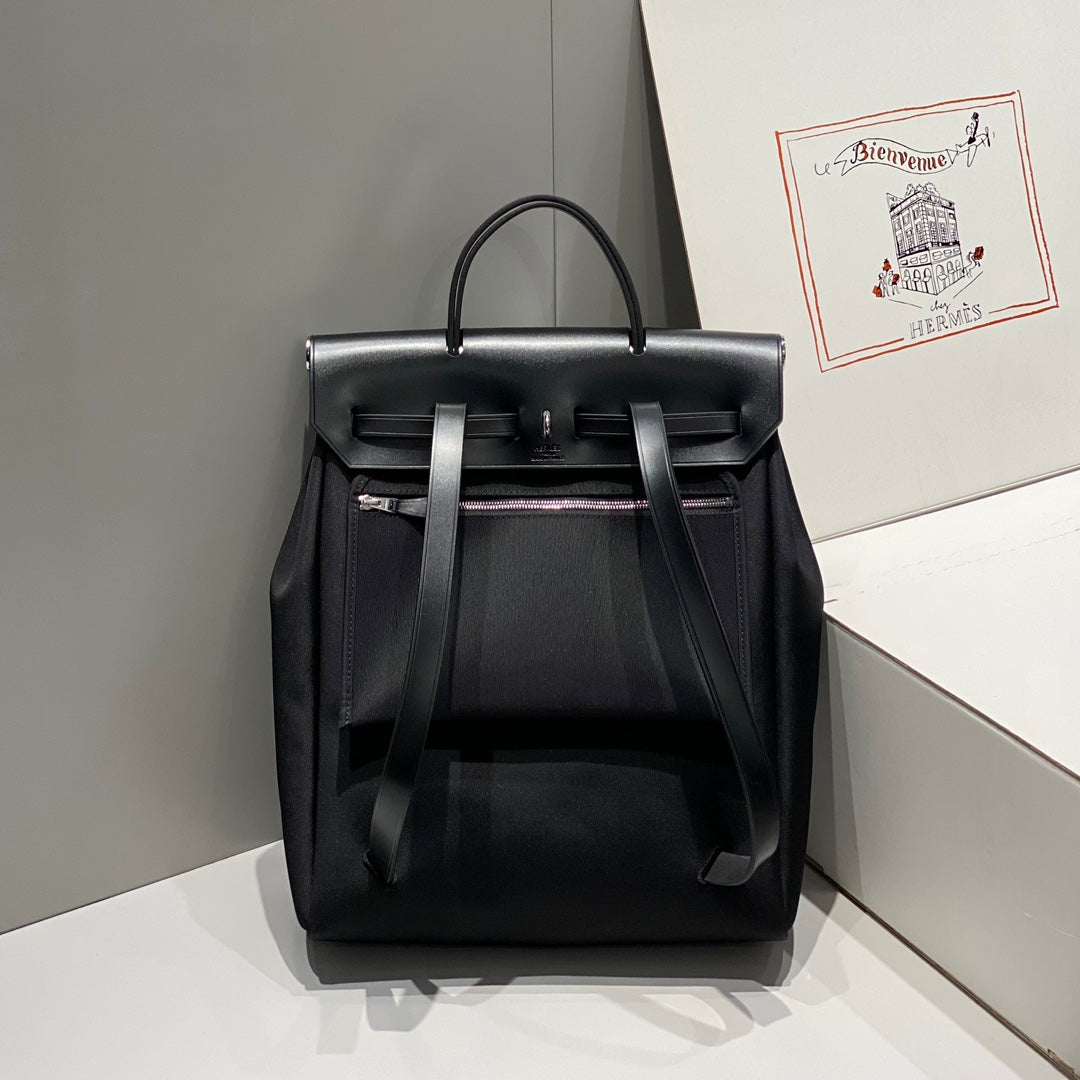 HERMES HERBAG A DOS ZIP RETOURNE BACKPACK 29 IN BLACK CANVAS AND CALFSKIN