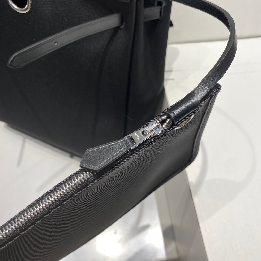 HERMES HERBAG A DOS ZIP RETOURNE BACKPACK 29 IN BLACK CANVAS AND CALFSKIN