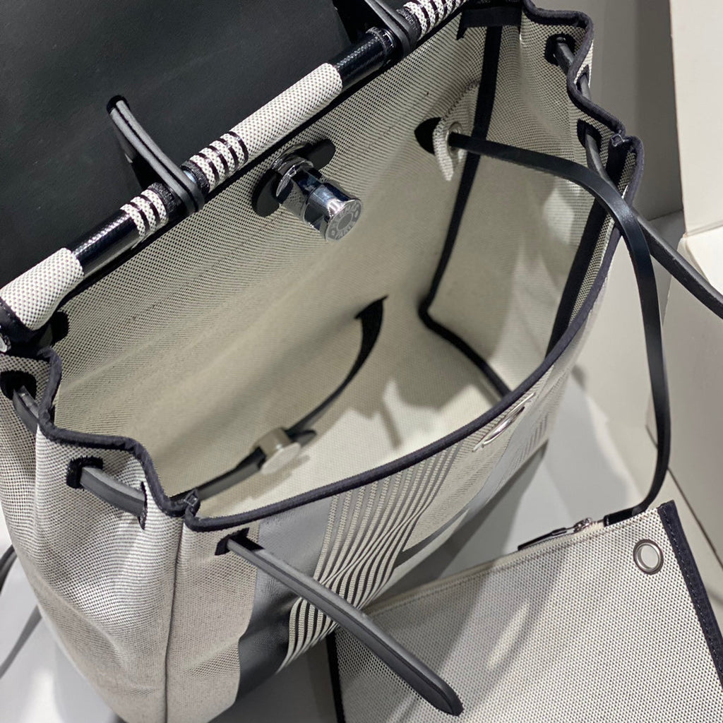 HERMES HERBAG A DOS ZIP RETOURNE BACKPACK 29 IN OFF-WHITE MIX BLACK CANVAS AND CALFSKIN