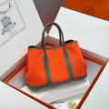 HERMES GARDEN PARTY 30CM IN ORANGE MINIMUM TOILETS COTTON CANVAS AND BROWN CALFSKIN