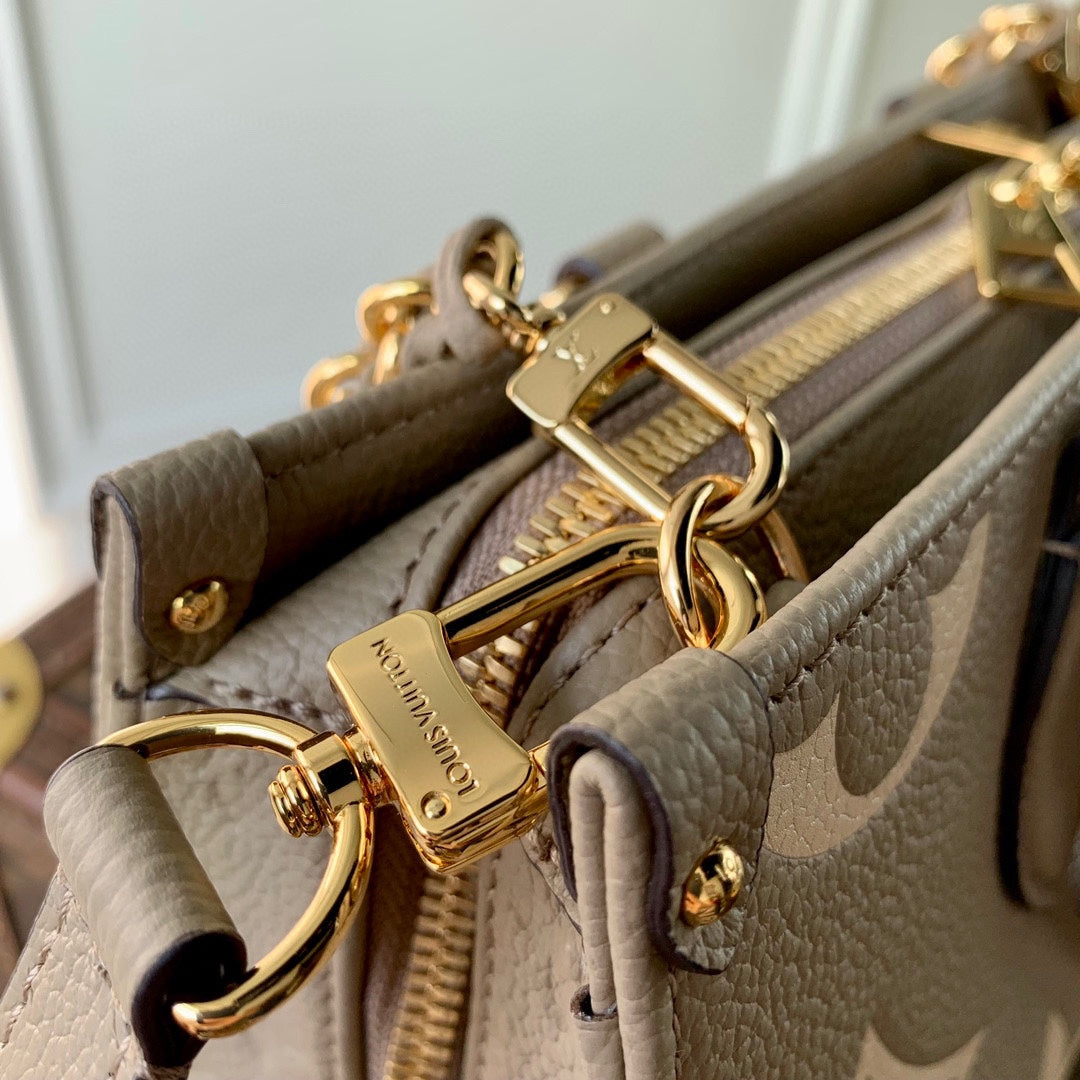 LOUIS VUITTON ONTHEGO EAST WEST BAG 25 IN GREEN MONOGRAM EMBOSSED COWHIDE
