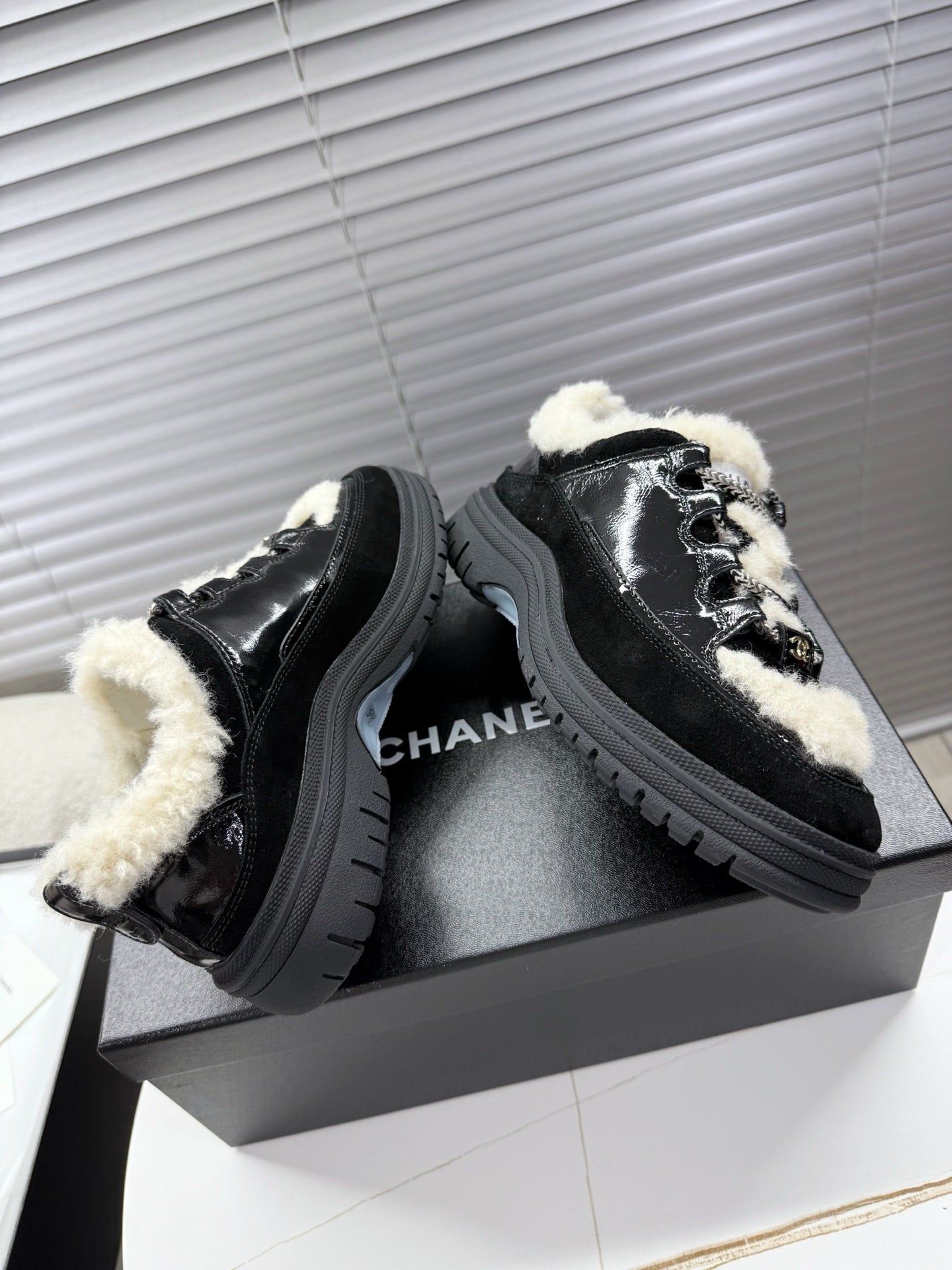 CHANEL 25S SNEAKERS WITH FUR AENTS 35MM IN BLACK CALFSKIN