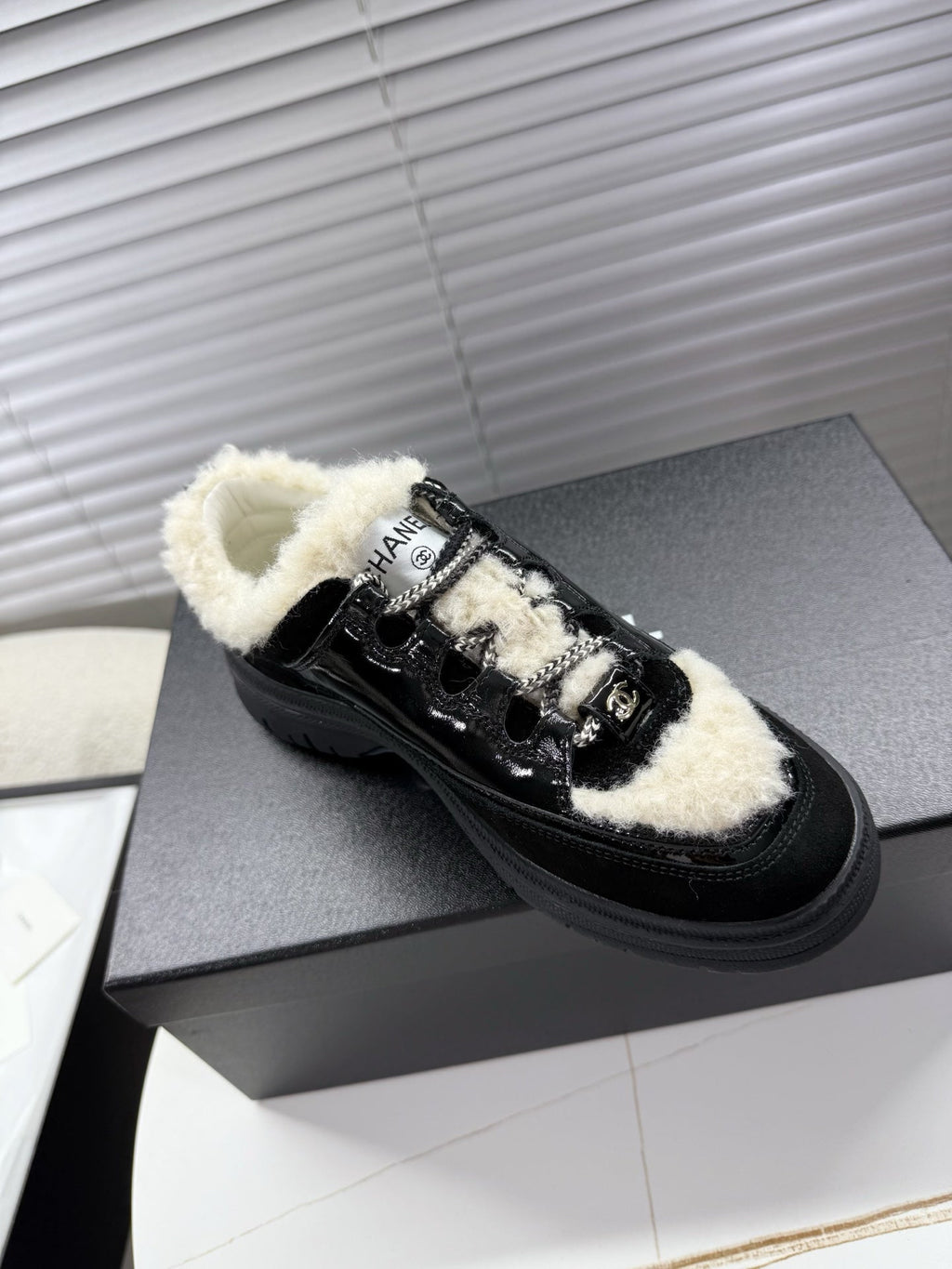CHANEL 25S SNEAKERS WITH FUR AENTS 35MM IN BLACK CALFSKIN