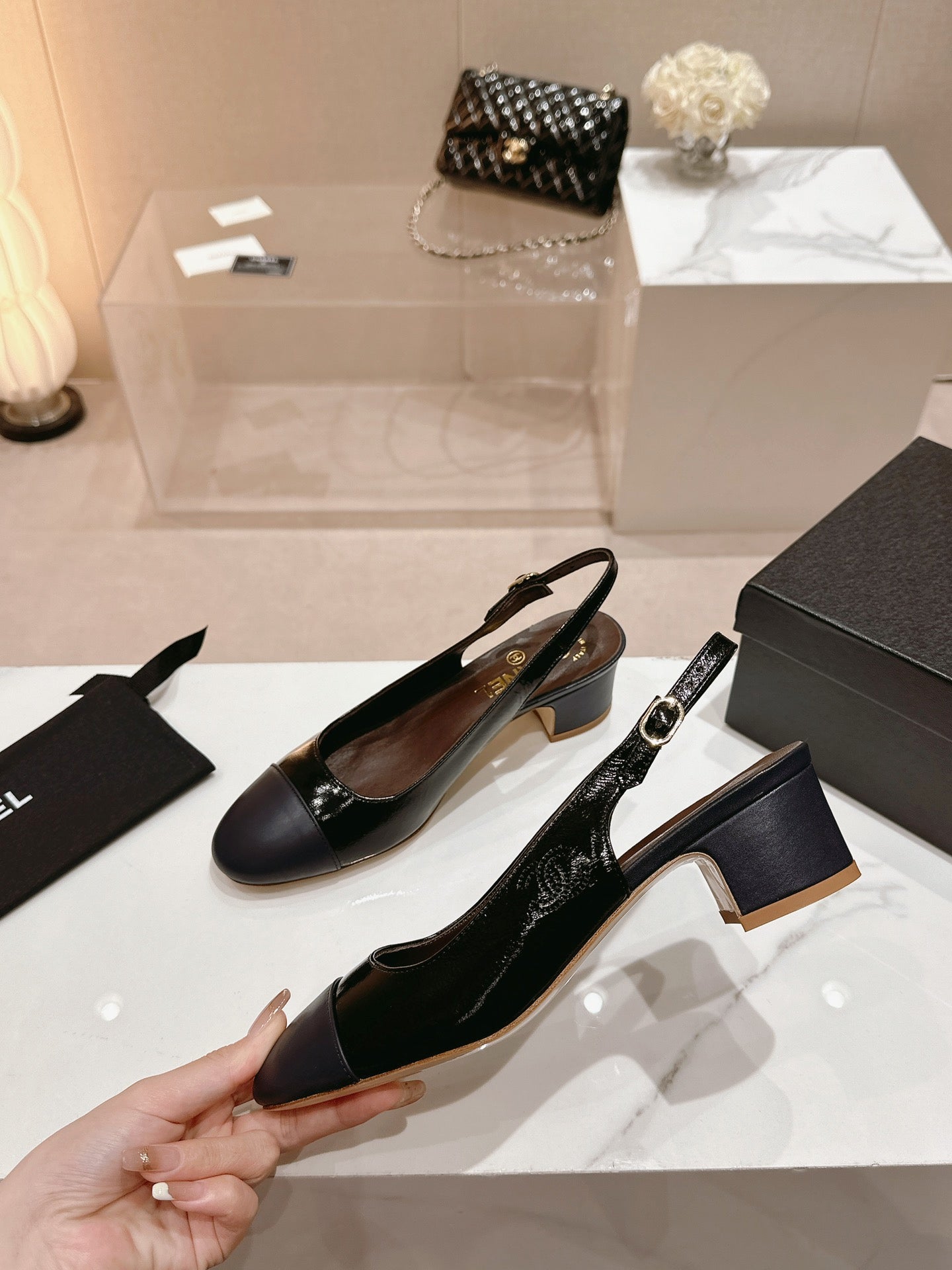 CHANEL SLINGBACKS IN BLACK SHEEPSKIN