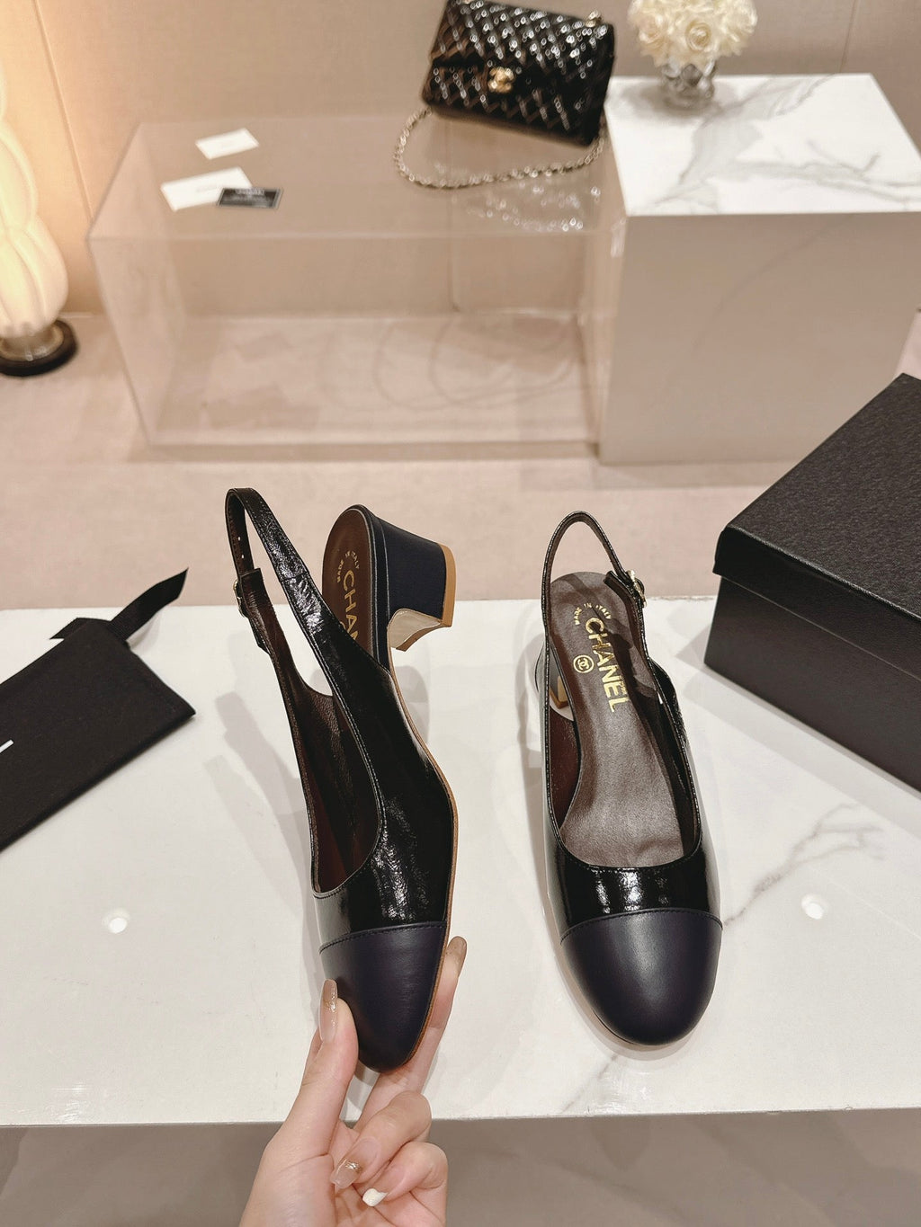 CHANEL SLINGBACKS IN BLACK SHEEPSKIN