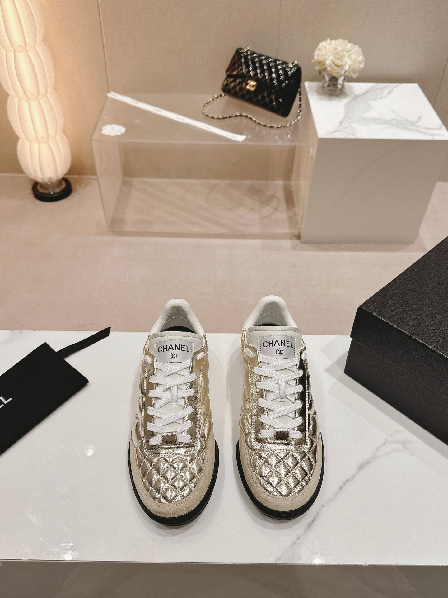 CHANEL SNEAKERS IN GLOSSY GOLDEN LAMBSKIN