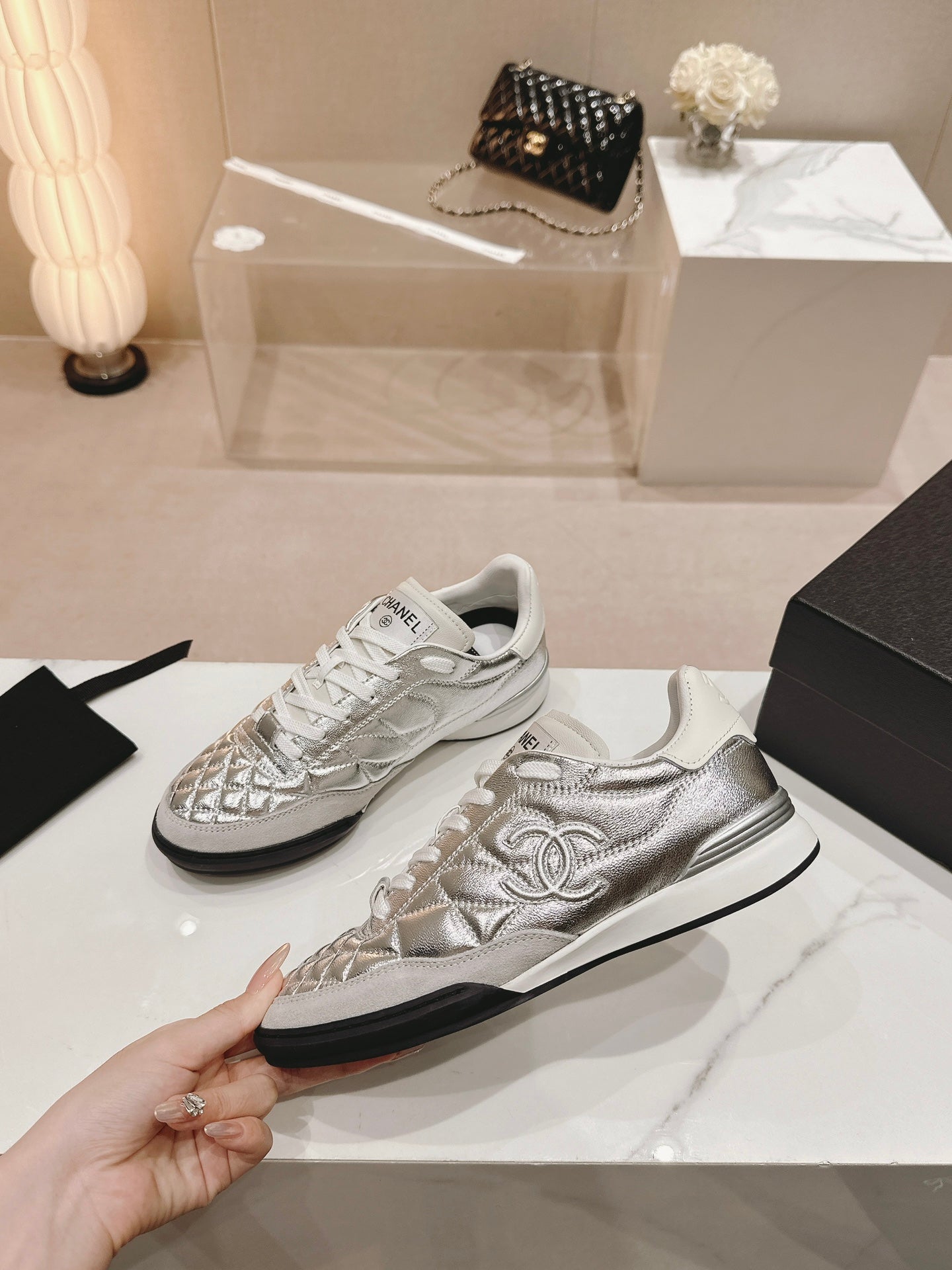 CHANEL SNEAKERS IN GLOSSY SILVER LAMBSKIN