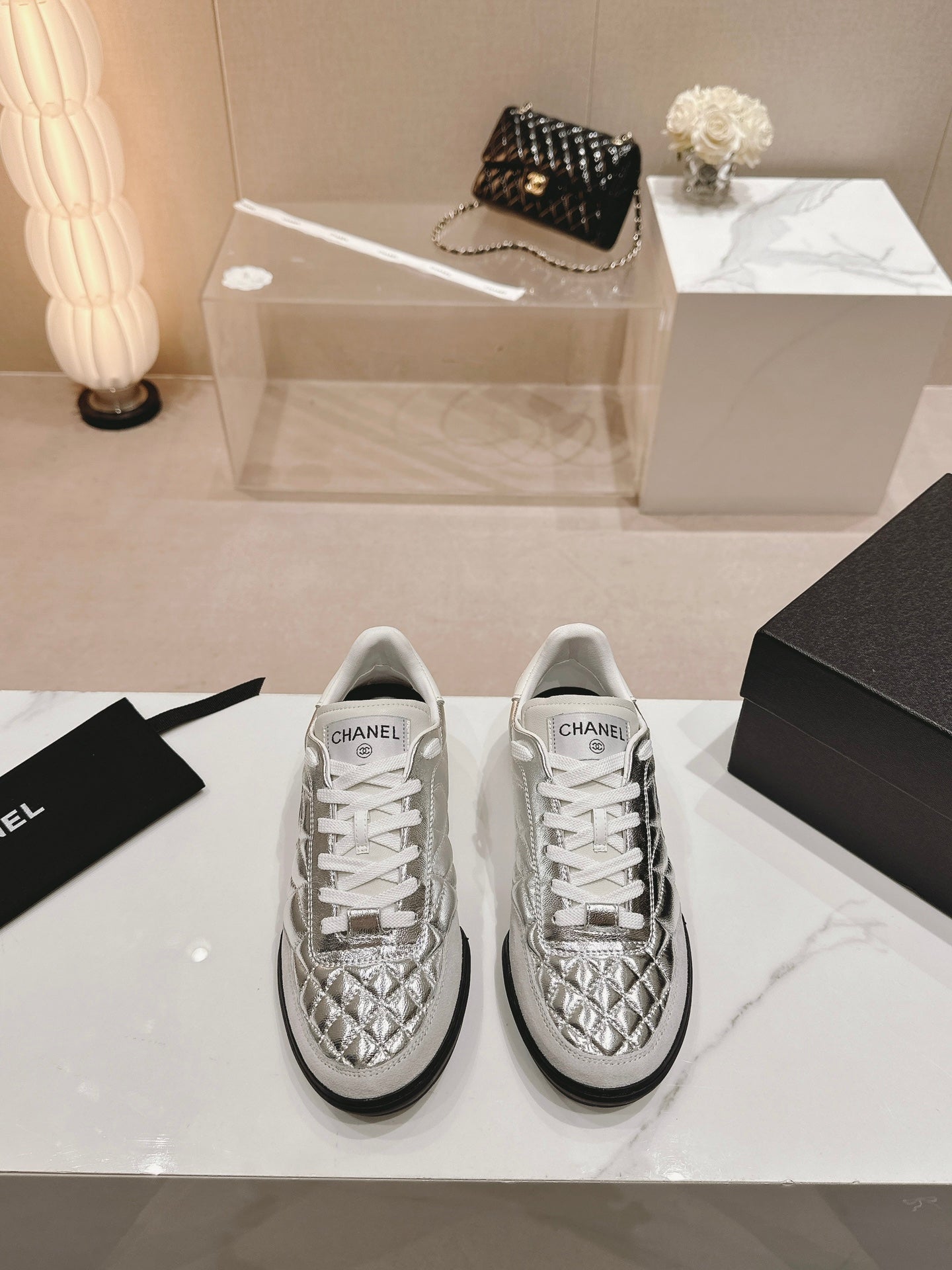 CHANEL SNEAKERS IN GLOSSY SILVER LAMBSKIN
