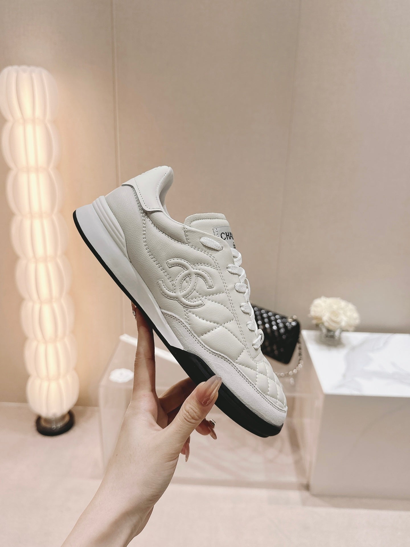 CHANEL SNEAKERS IN GLOSSY WHITE LAMBSKIN