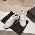 CHANEL SNEAKERS IN GLOSSY WHITE LAMBSKIN