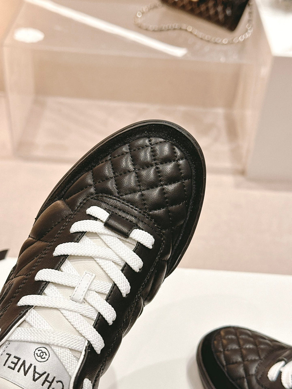 CHANEL SNEAKERS IN GLOSSY BLACK LAMBSKIN