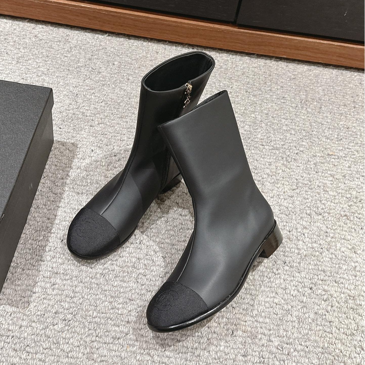 CHANEL SHORT BOOTS IN BLACK LAMBSKIN AND FABRIC