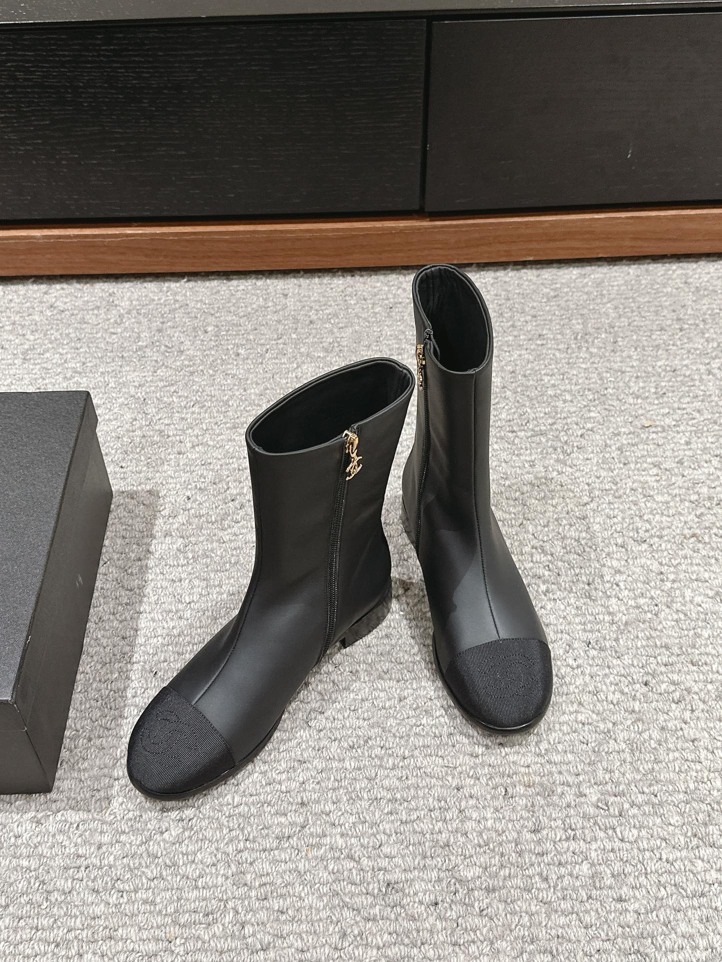 CHANEL SHORT BOOTS IN BLACK LAMBSKIN AND FABRIC