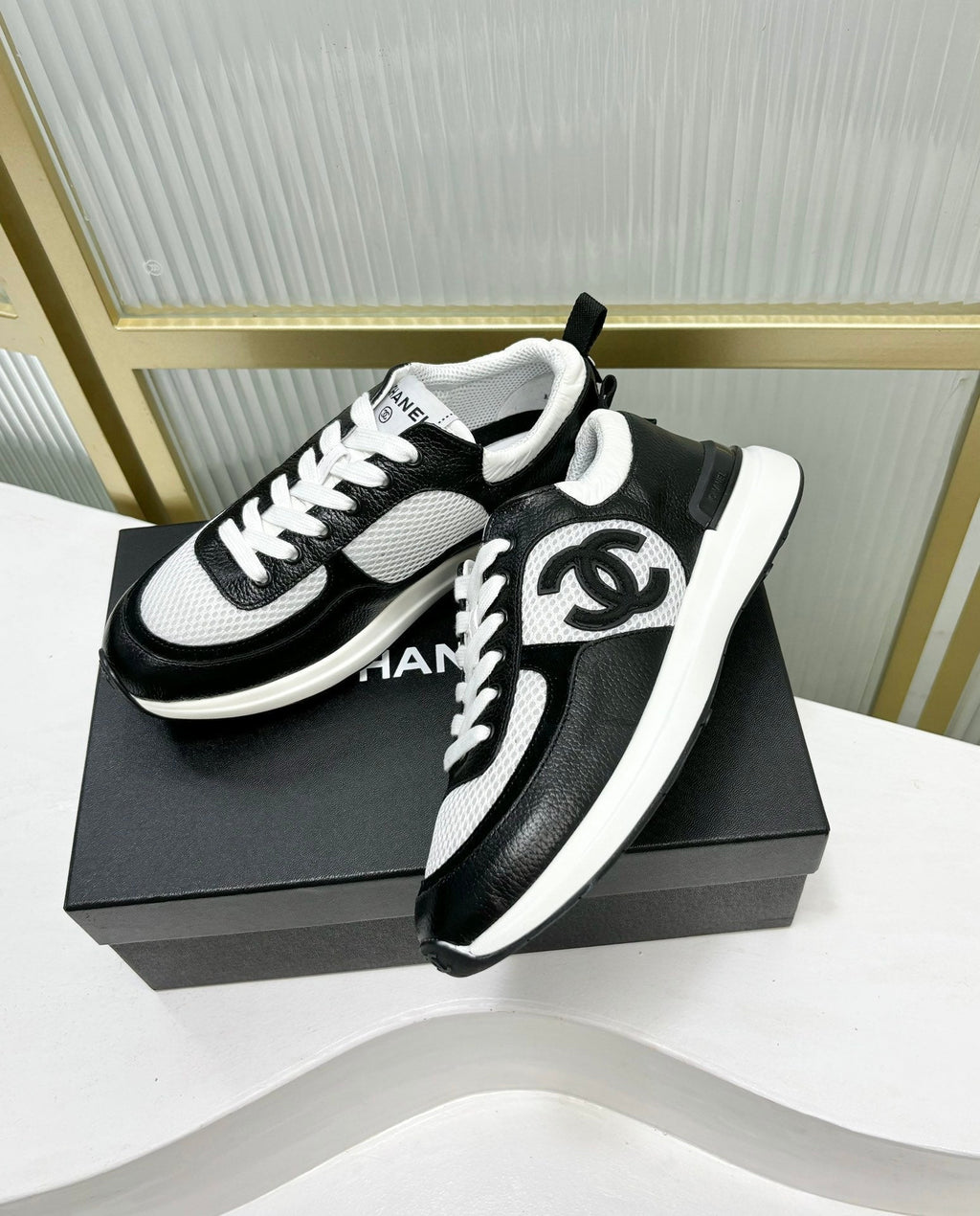 CHANEL SNEAKER IN BLACK CALFSKIN AND GREY BREATHABLE MESH