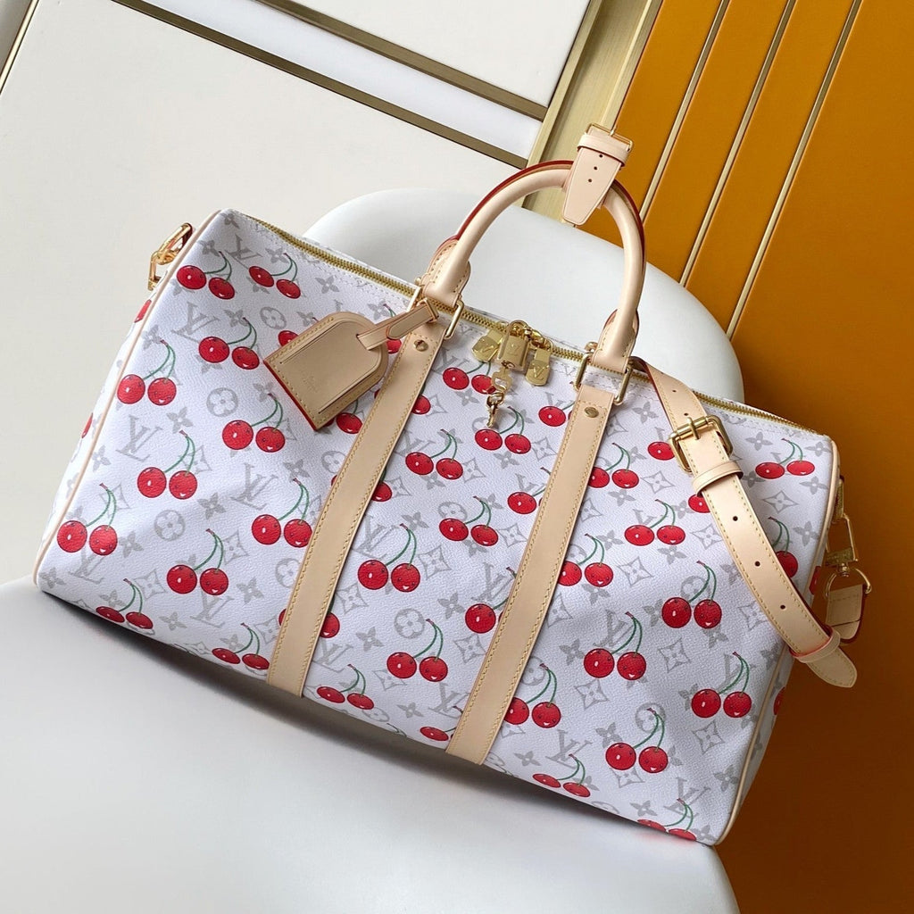 LOUIS VUITTON KEEPALL BANDOULIÈRE 45 IN WHITE AND RED CALFSKIN