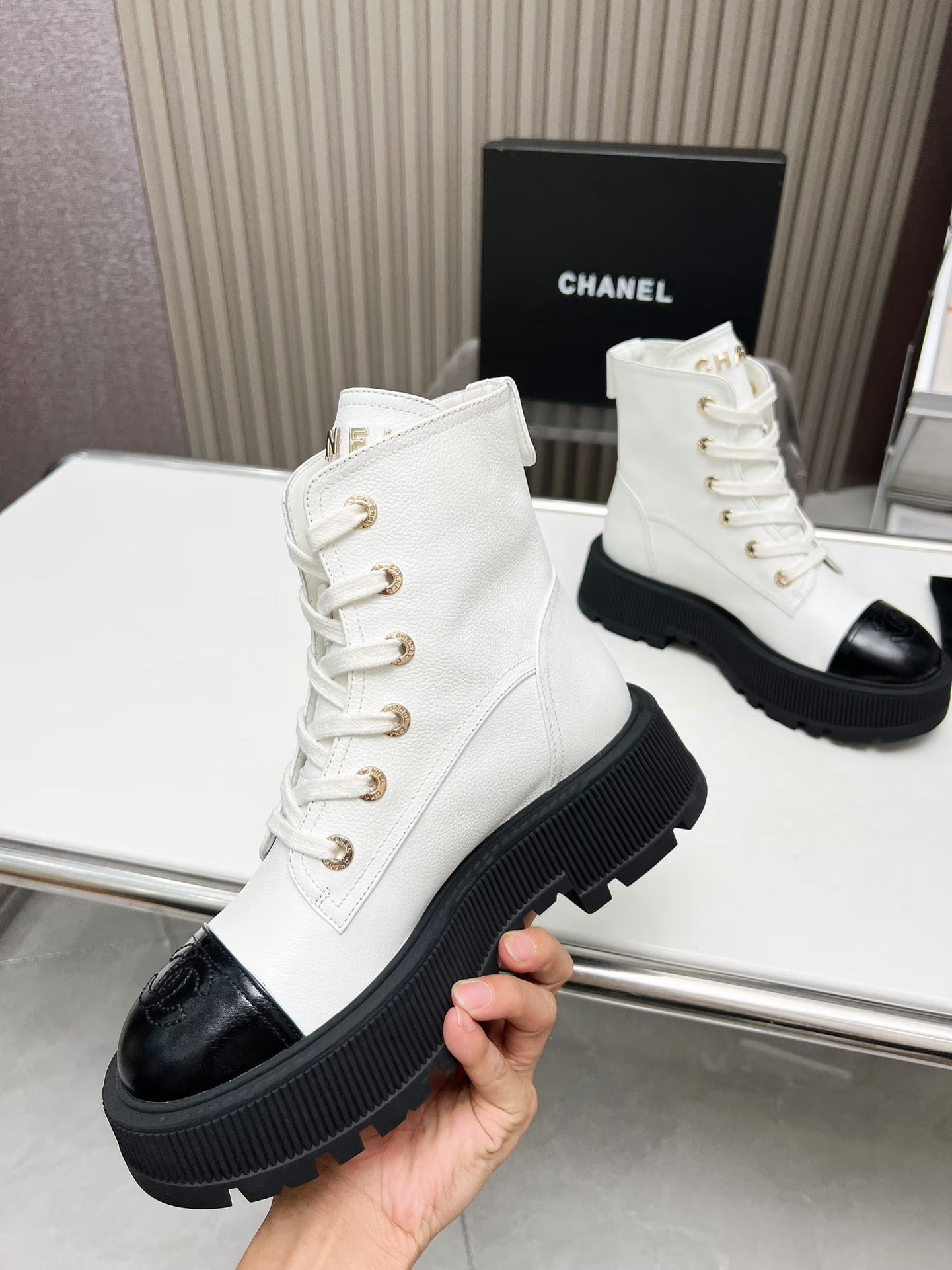 CHANEL SHORT BOOTS IN WHITE MIX BLACK COWHIDE