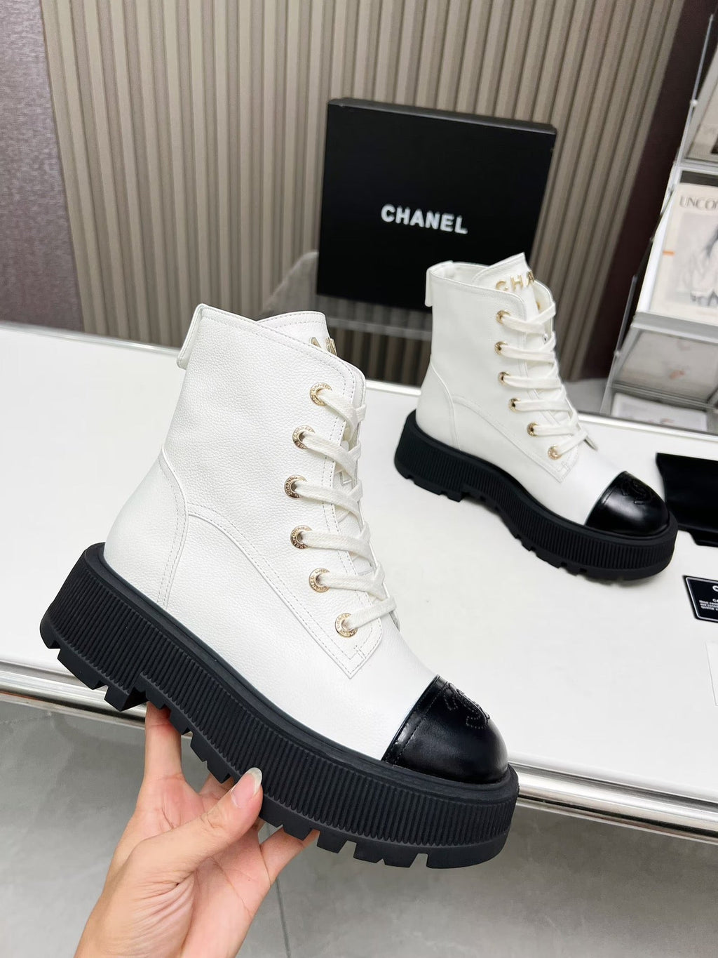 CHANEL SHORT BOOTS IN WHITE MIX BLACK COWHIDE