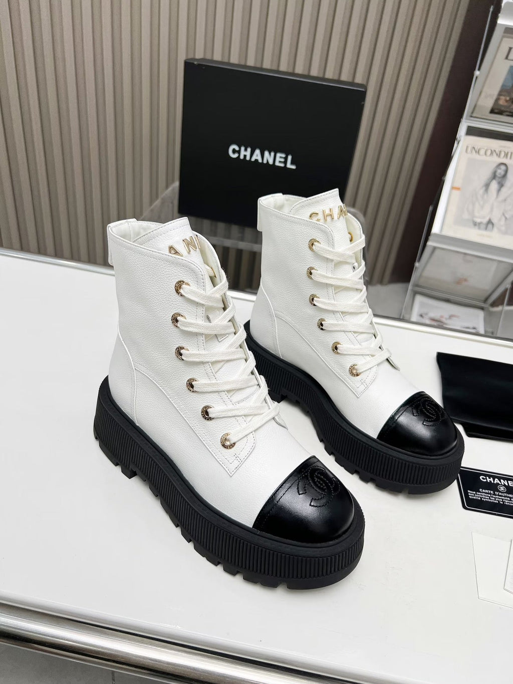 CHANEL SHORT BOOTS IN WHITE MIX BLACK COWHIDE
