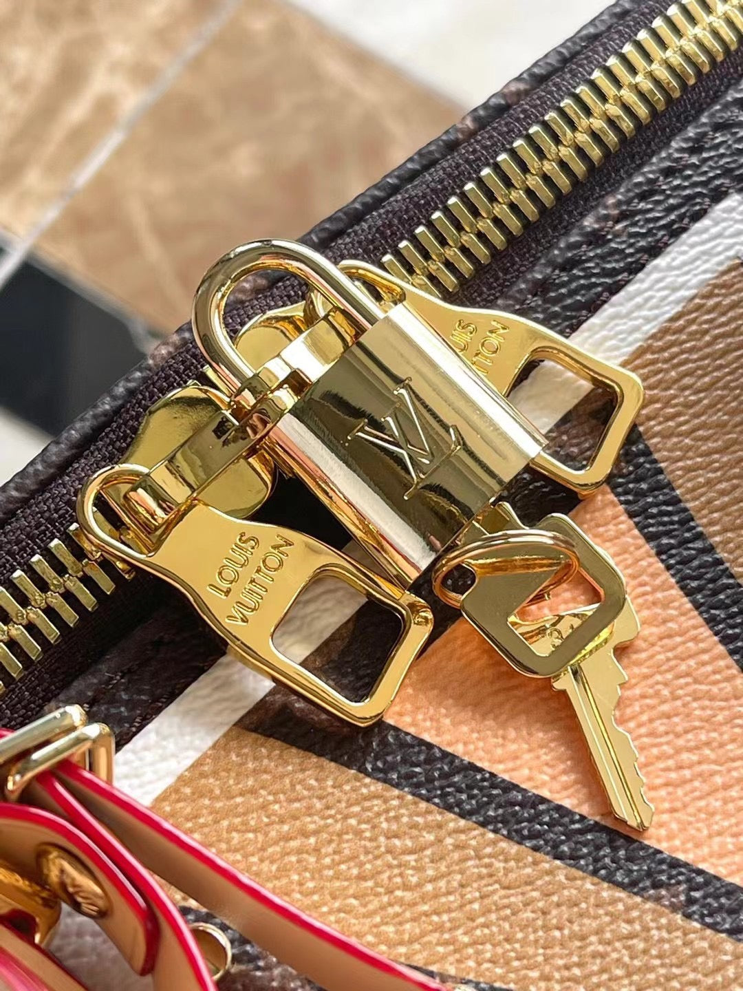 LOUIS VUITTON KEEPALL BANDOULIÈRE 50 IN PARFLECHE PATTERN MONOGRAM CANVAS