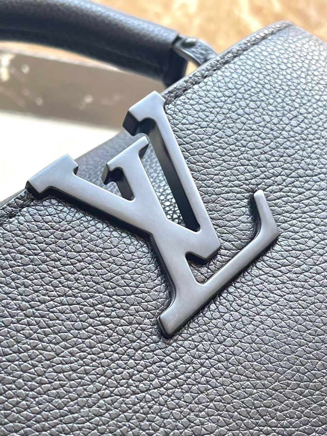 LOUIS VUITTON CAPUCINES EAST-WEST MINI 21 IN BLACK TAURILLON