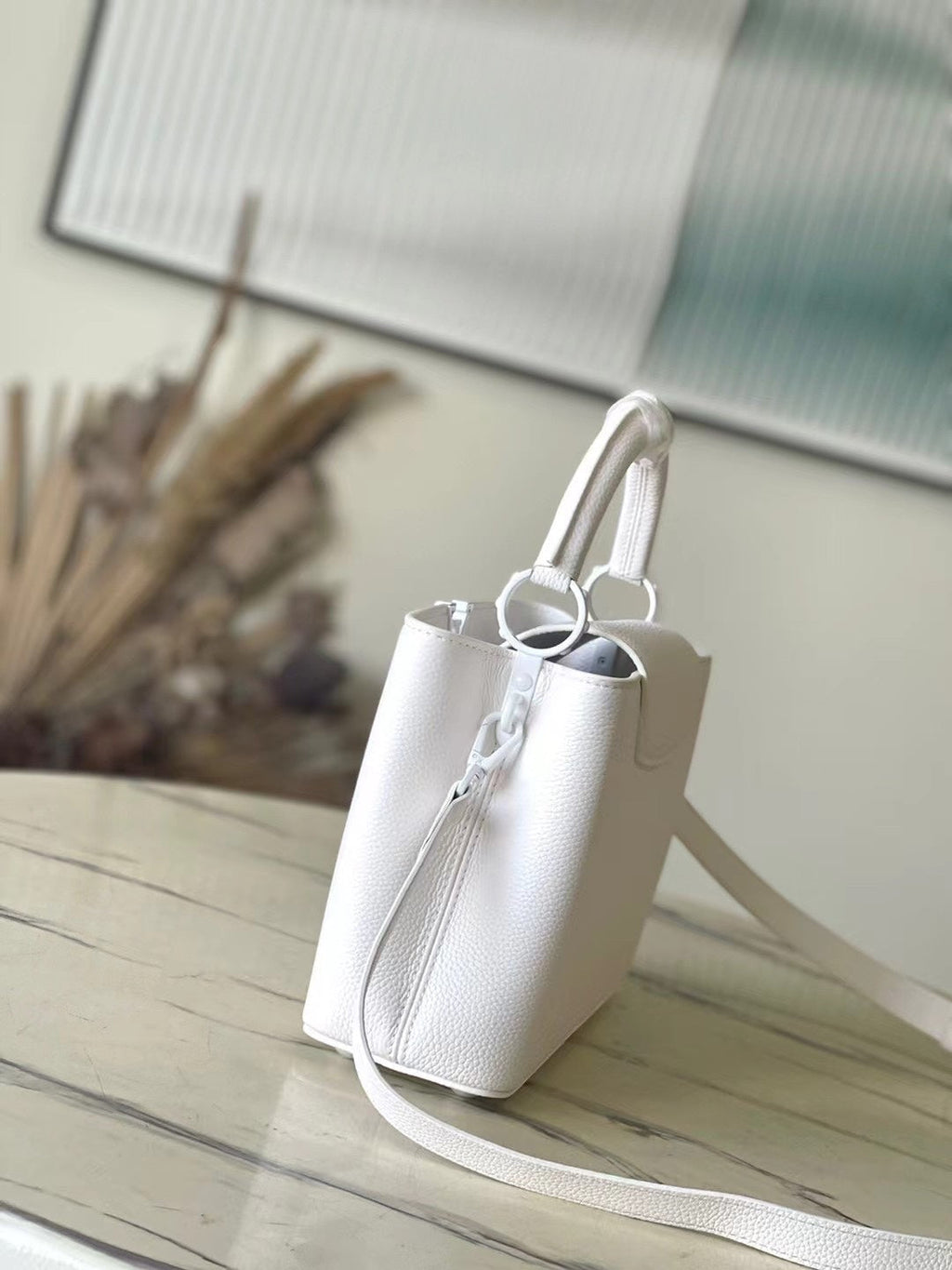 LOUIS VUITTON CAPUCINES EAST-WEST BB 27 IN WHITE TAURILLON
