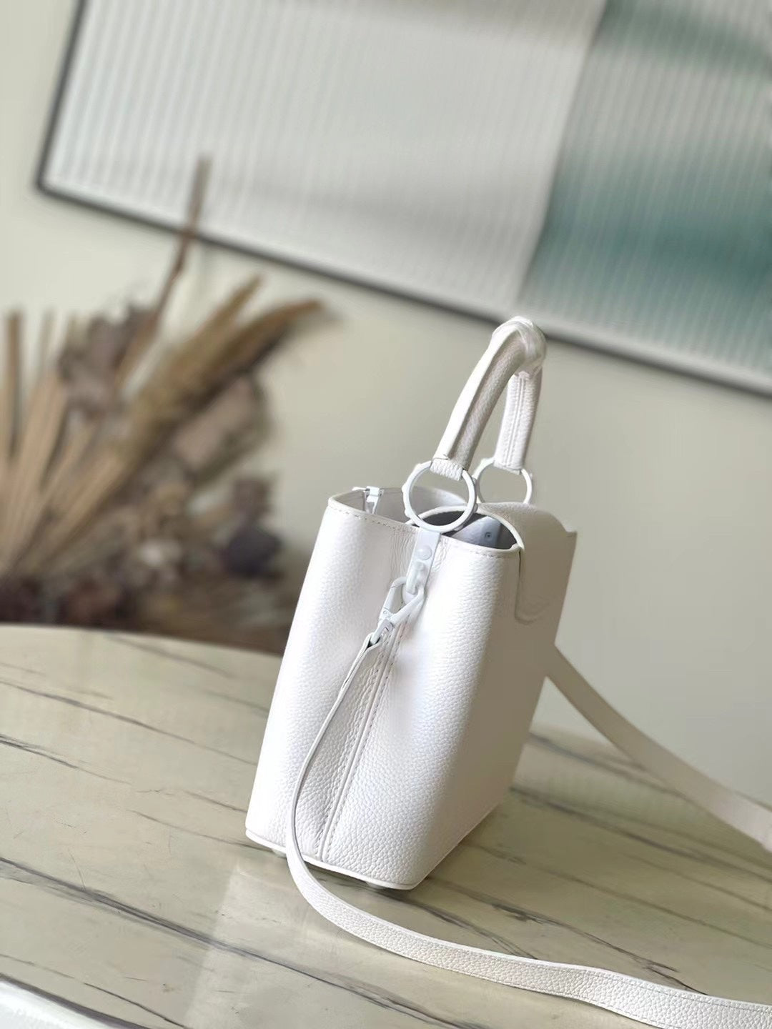 LOUIS VUITTON CAPUCINES EAST-WEST BB 27 IN WHITE TAURILLON