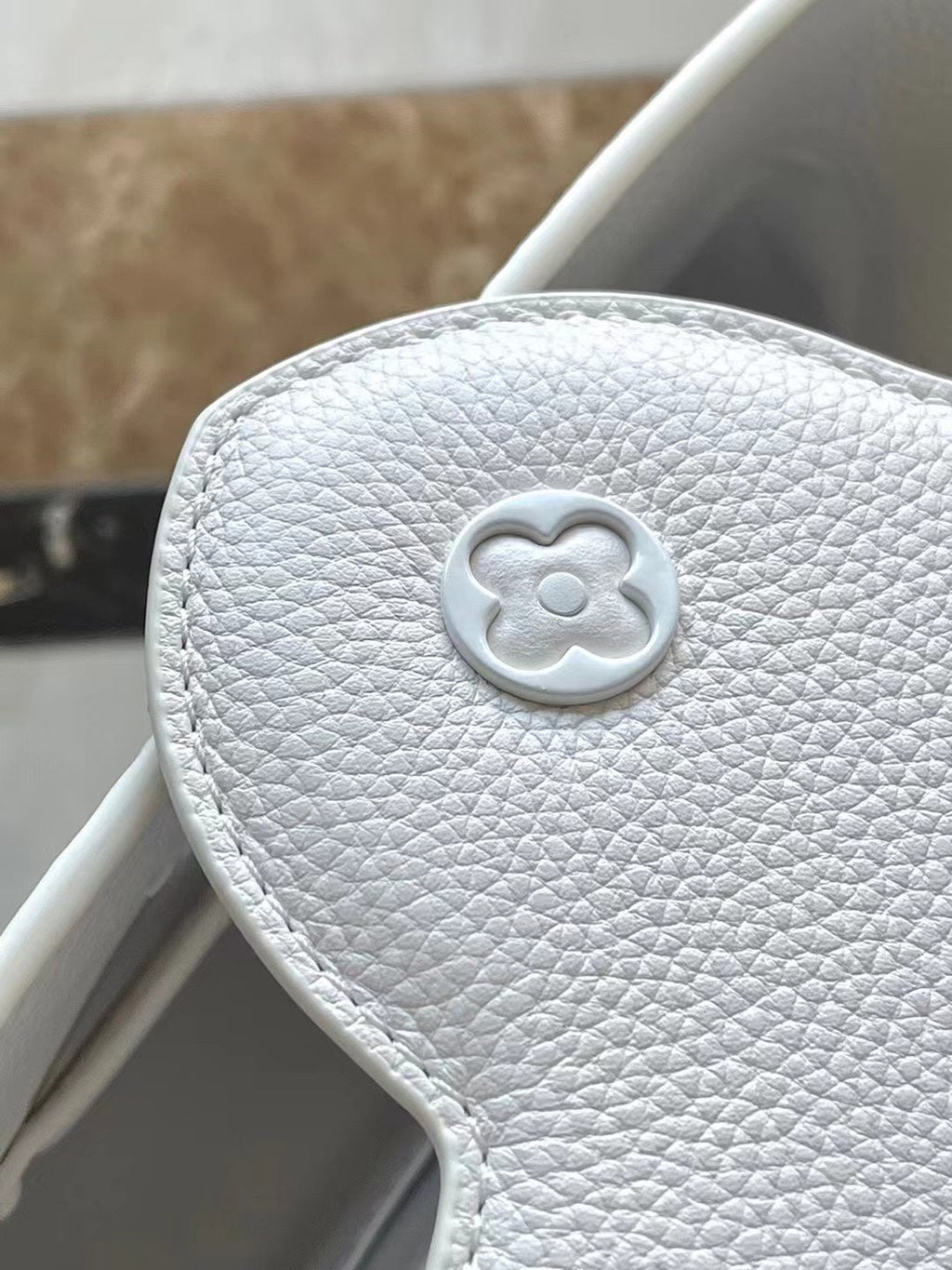 LOUIS VUITTON CAPUCINES EAST-WEST BB 27 IN WHITE TAURILLON