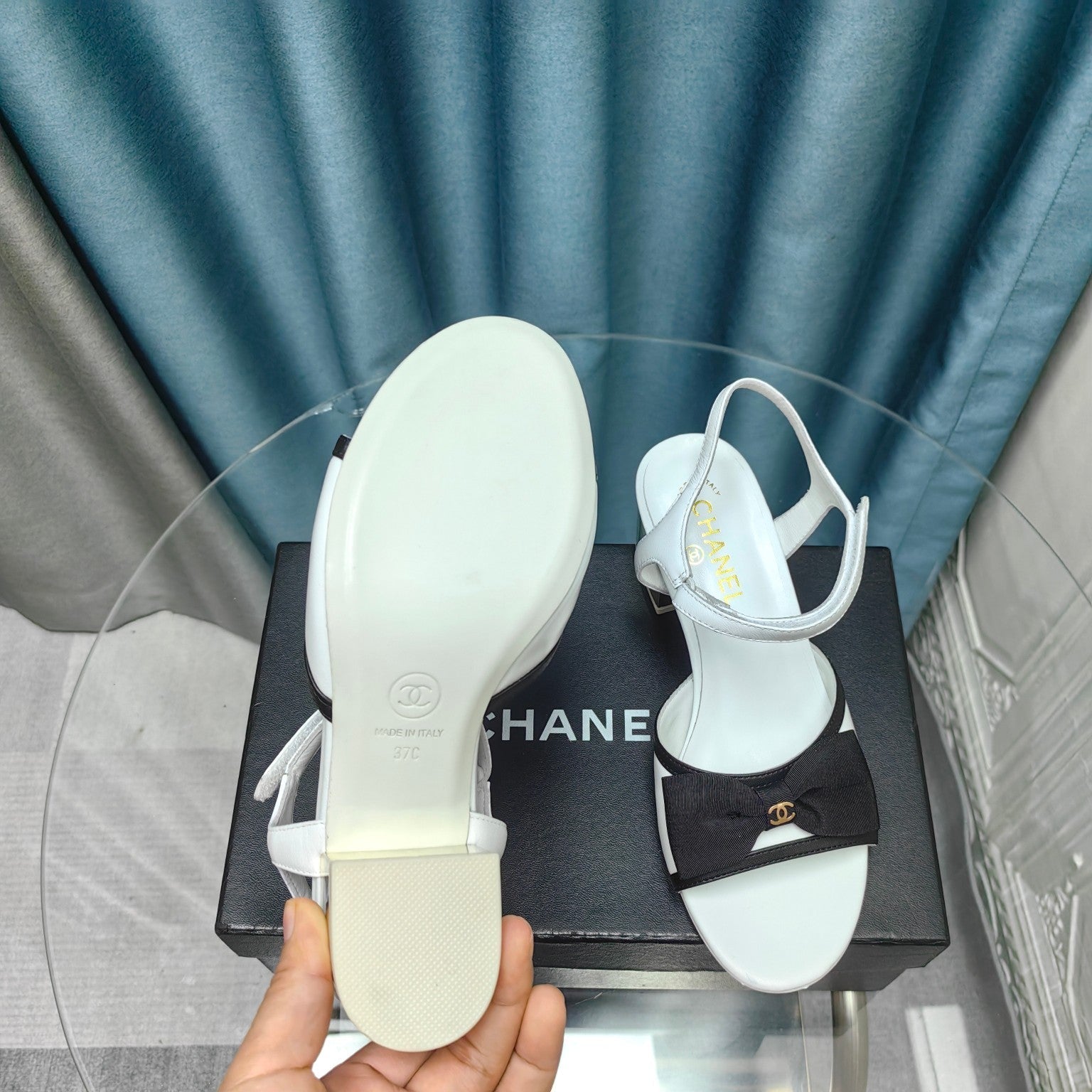 CHANEL SANDALS IN WHITE SHEEPSKIN WITH BLACK SATIN BOW