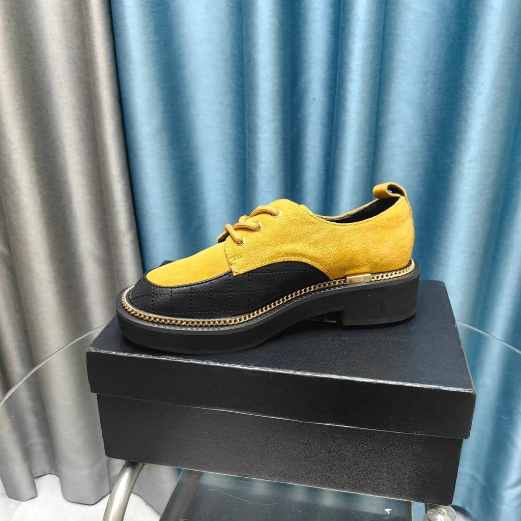 CHANEL OXFORD SHOES IN GOLD YELLOW SUEDE AND BLACK SHEEPSKIN