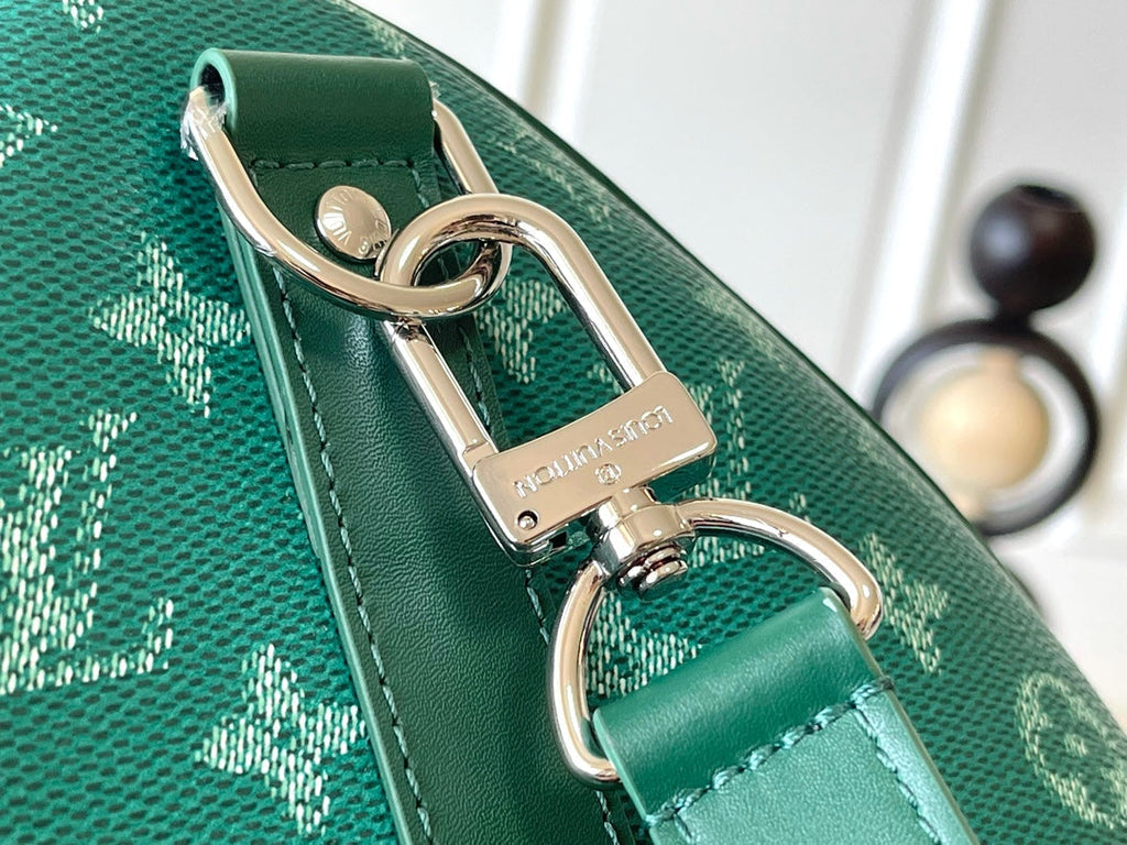 LOUIS VUITTON KEEPALL BANDOULIÈRE 50 IN GREEN MONOGRAM HERITAGE CANVAS