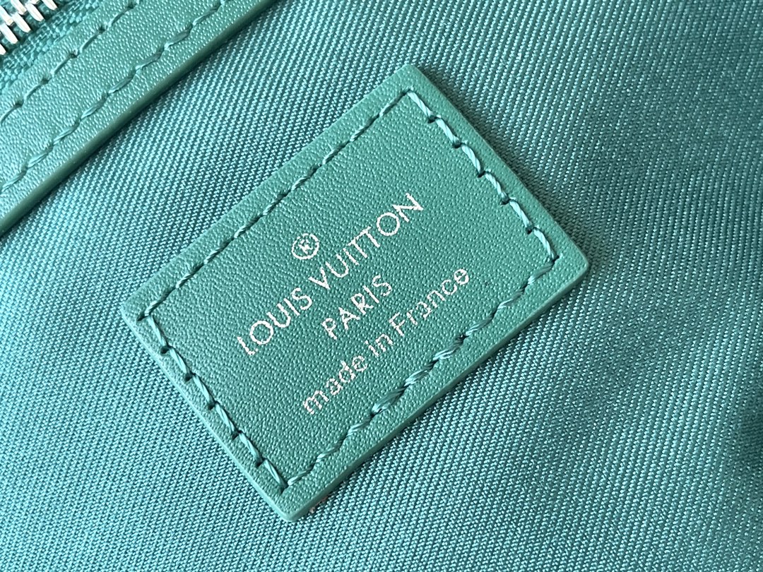 LOUIS VUITTON KEEPALL BANDOULIÈRE 50 IN GREEN MONOGRAM HERITAGE CANVAS
