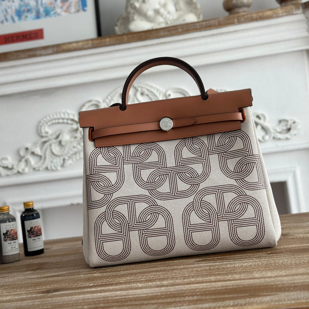 HERMES HERBAG ZIP 31 LAQUERED BAG IN OFF-WHITE MIX BROWN H PLUME CANVAS AND BROWN COWHIDE