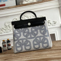 HERMES HERBAG ZIP 31 LAQUERED BAG IN OFF-WHITE MIX BLUE H PLUME CANVAS