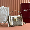 GUCCI 26S PADLOCK TOP HANDLE BAG 25 IN DARK BEIGE AND WHITE CALFSKIN