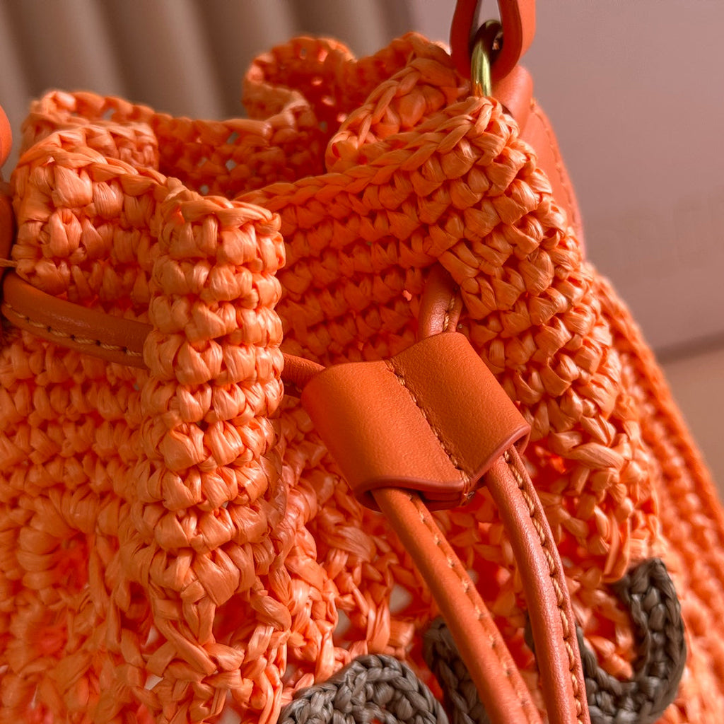 MIUMIU 26S WANDER BUCKET BAG 23 IN ORANGE RAFFIA WITH LEATHER TRIM