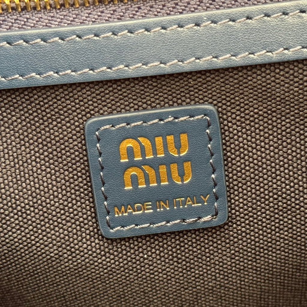 MIUMIU 26S MEDIUM BACKPACK 29 IN DARK BLUE CANVAS BLUE CALFSKIN