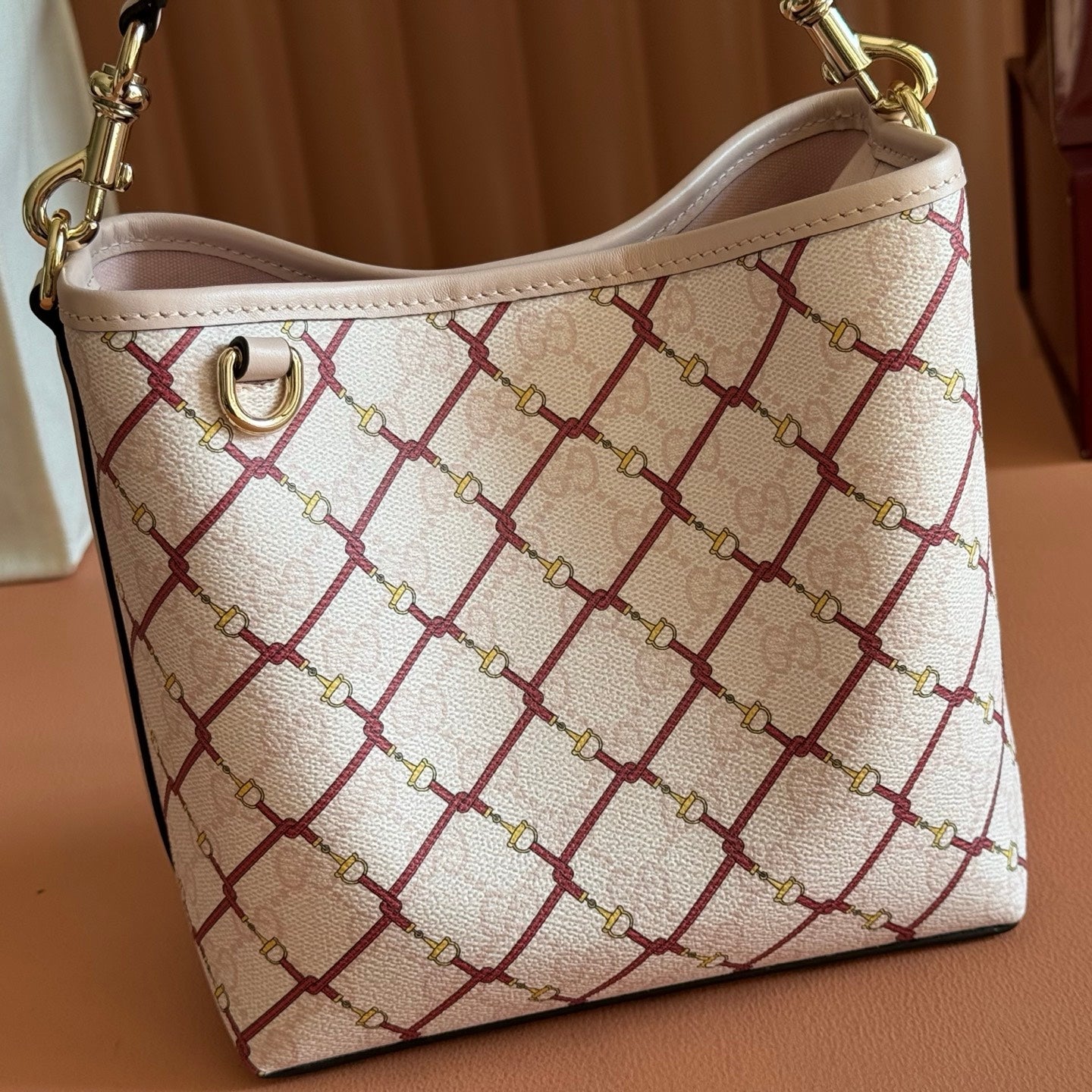 GUCCI 26S  EMBLEM BUCKET BAG 19 IN LIGHT PINK COATED FABRIC