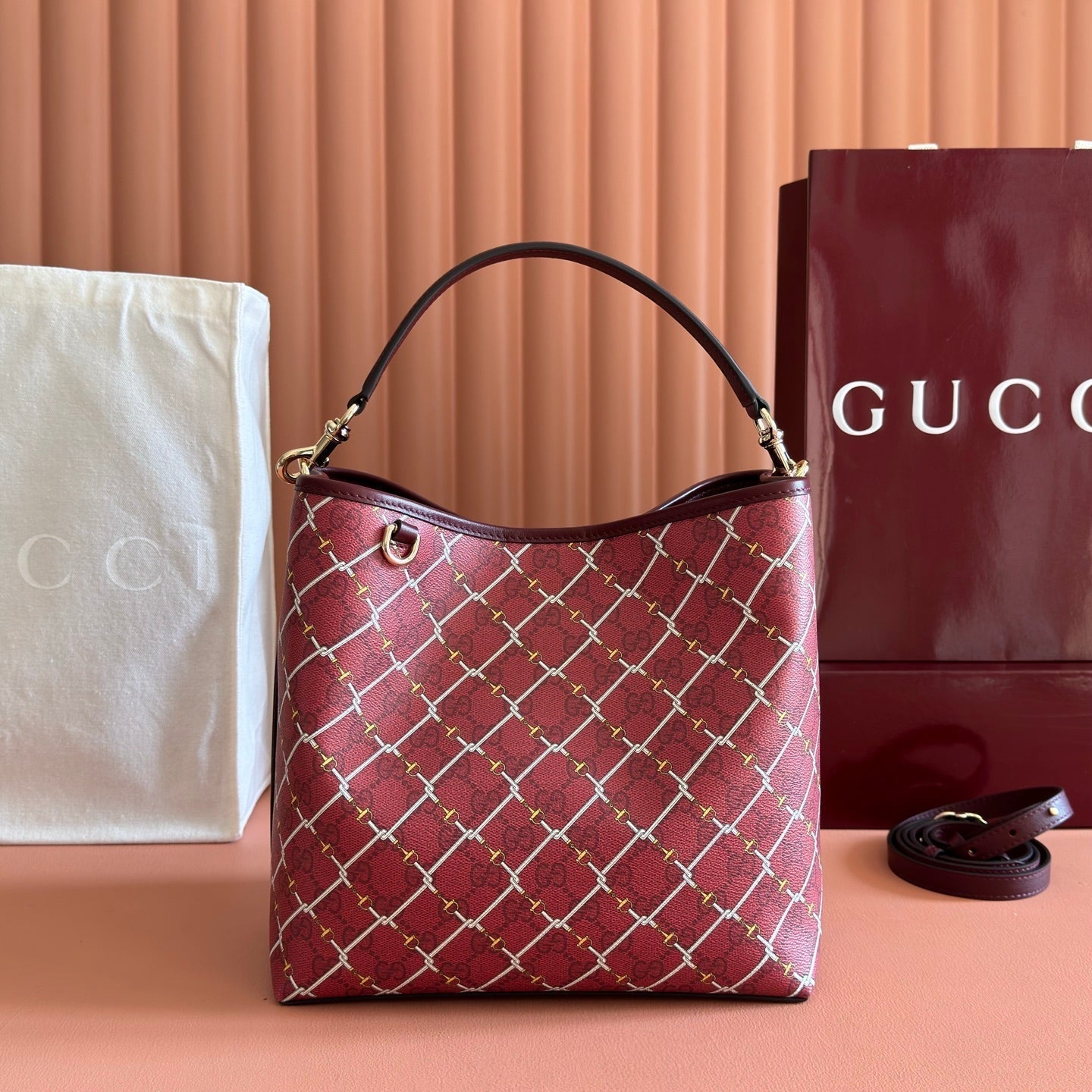 GUCCI 26S  EMBLEM BUCKET BAG 25 IN DARK RED COATED FABRIC