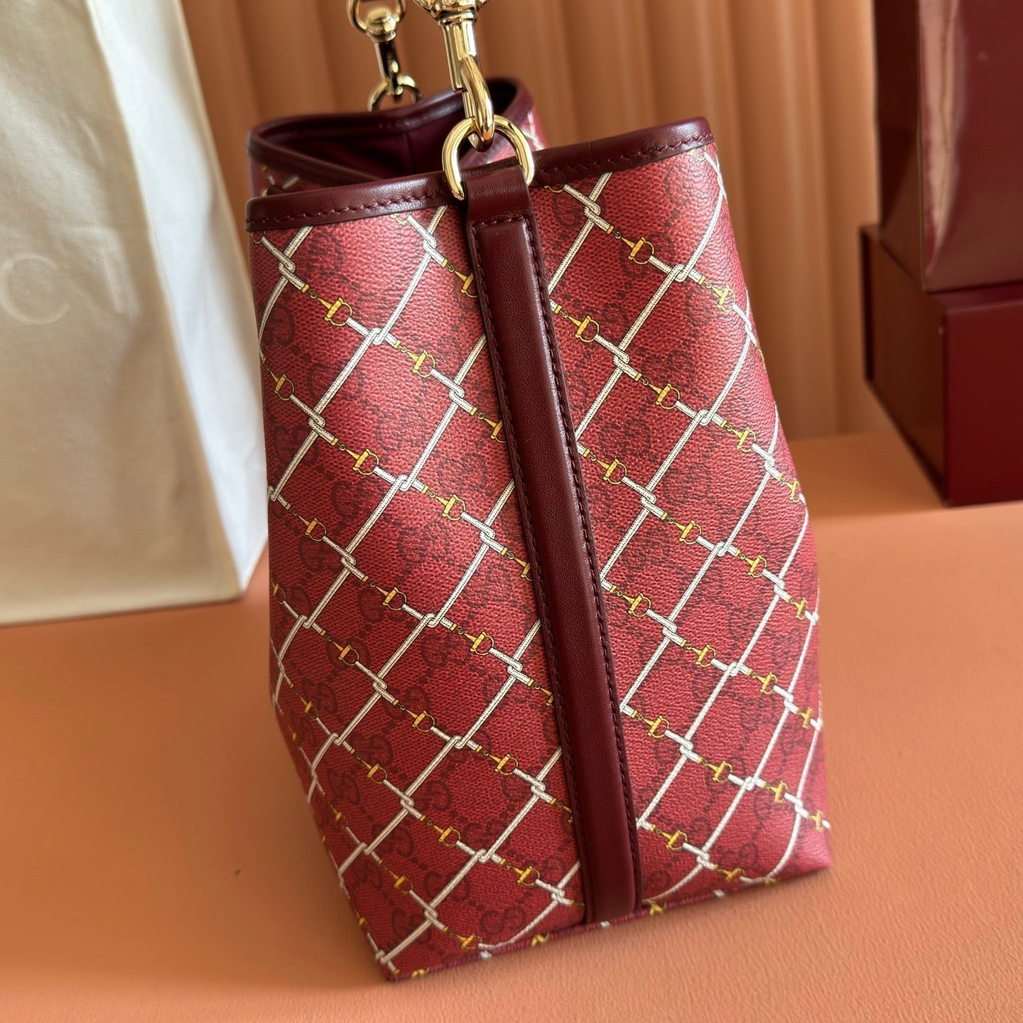 GUCCI 26S  EMBLEM BUCKET BAG 25 IN DARK RED COATED FABRIC