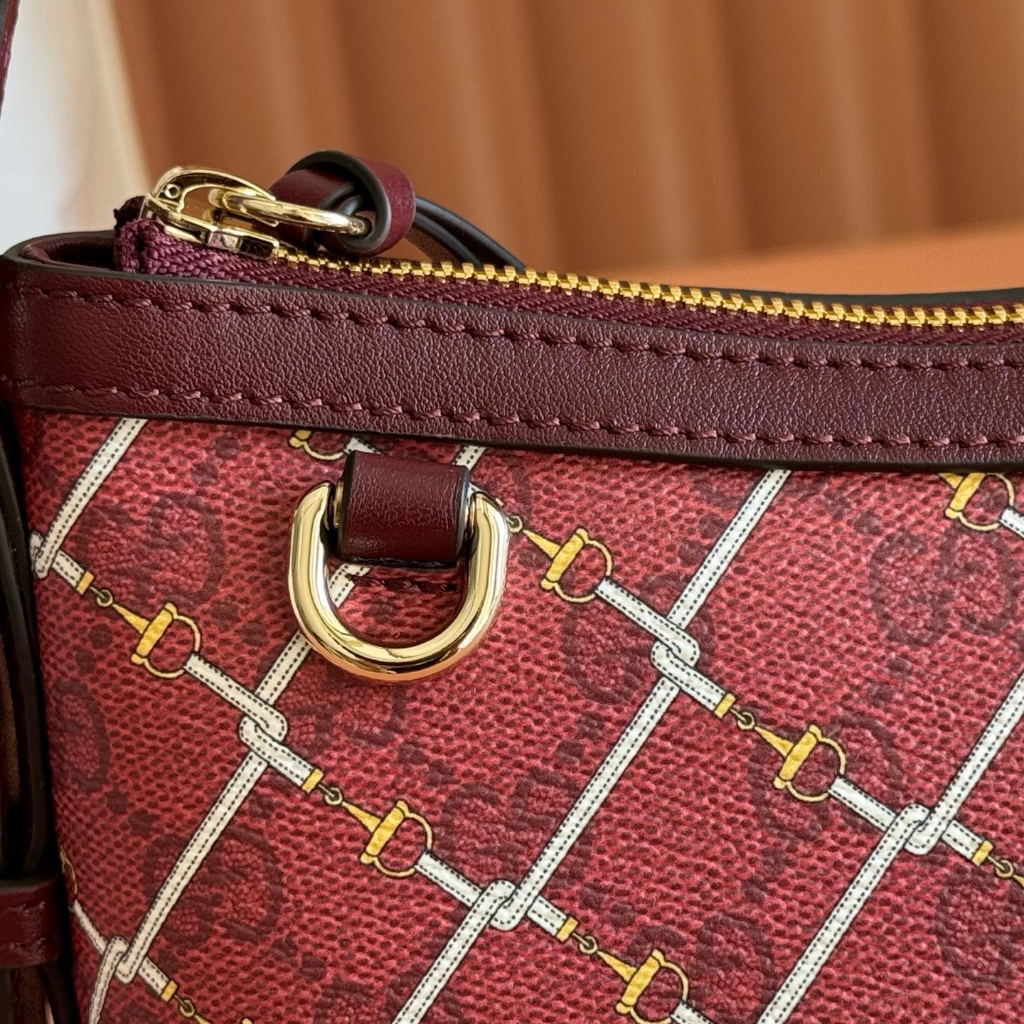 GUCCI 26S  EMBLEM BUCKET BAG 22 IN DARK RED COATED FABRIC