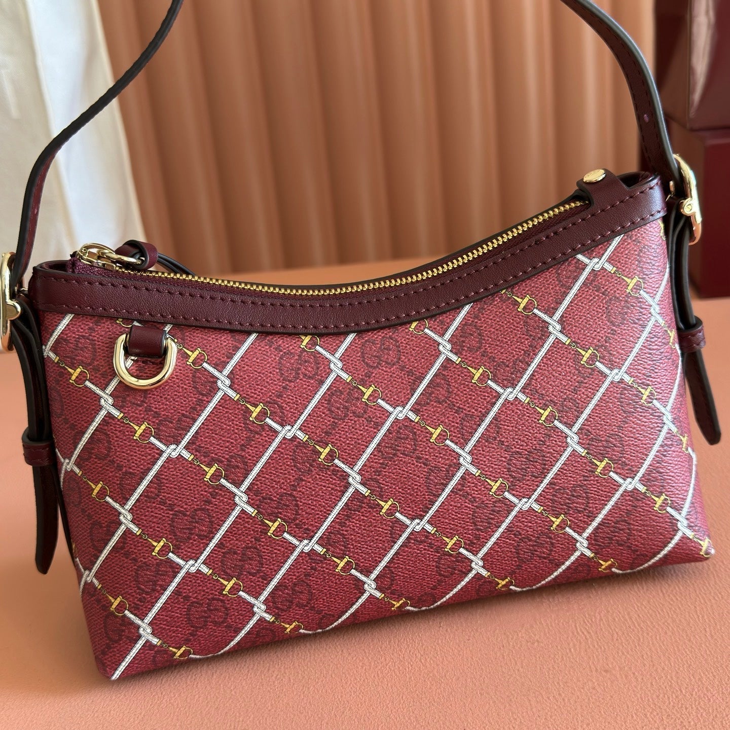 GUCCI 26S  EMBLEM BUCKET BAG 22 IN DARK RED COATED FABRIC