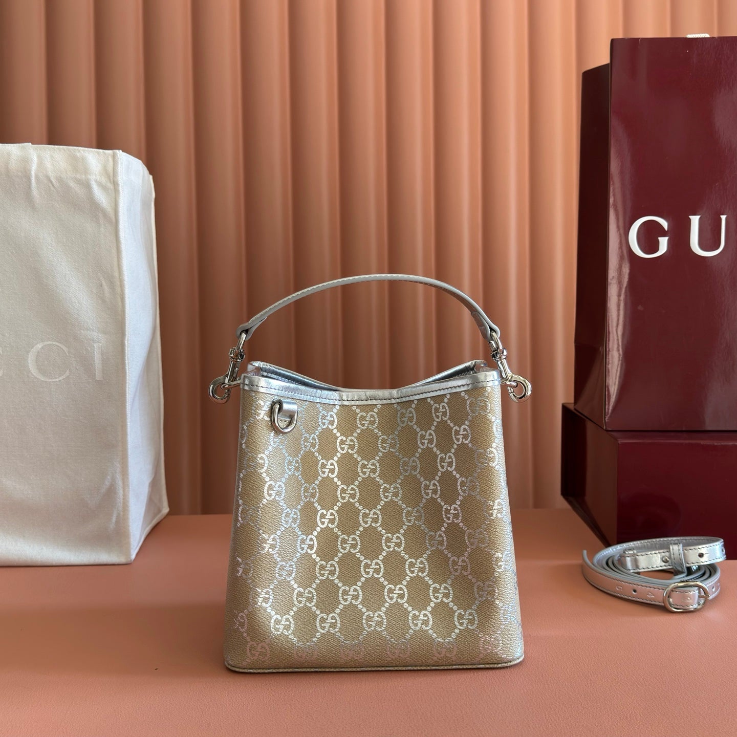 GUCCI 26S  EMBLEM BUCKET BAG 19 IN BEIGE AND SILVER CANVAS