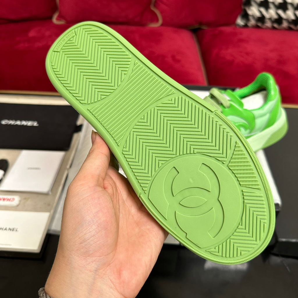 CHANEL TRAINERS IN LIGHT GREEN SHINY CALFSKIN