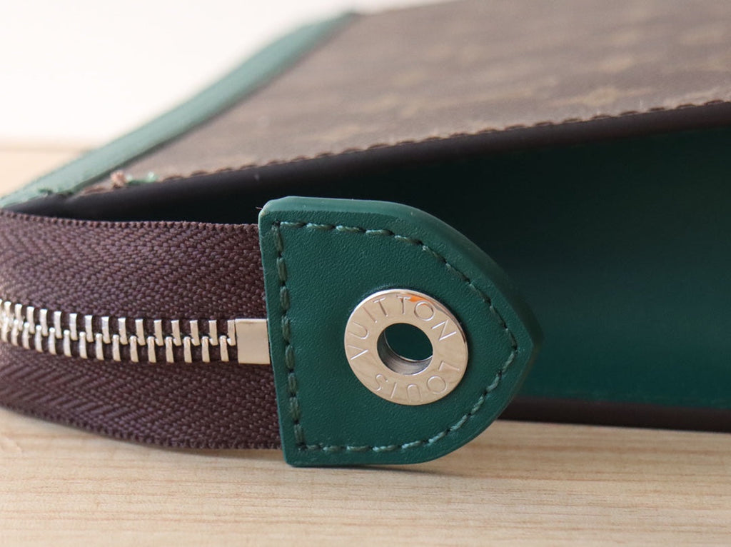 LOUIS VUITTON LV 25S POCHETTE VOYAGE 26 IN BORNEO GREEN MONOGRAM MACASSAR COATED CANVAS