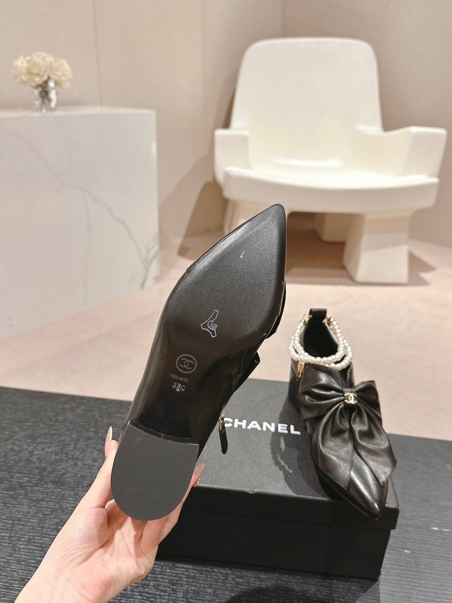 CHANEL SHORT BOOTS IN BLACK SHEEPSKIN WITH BOW