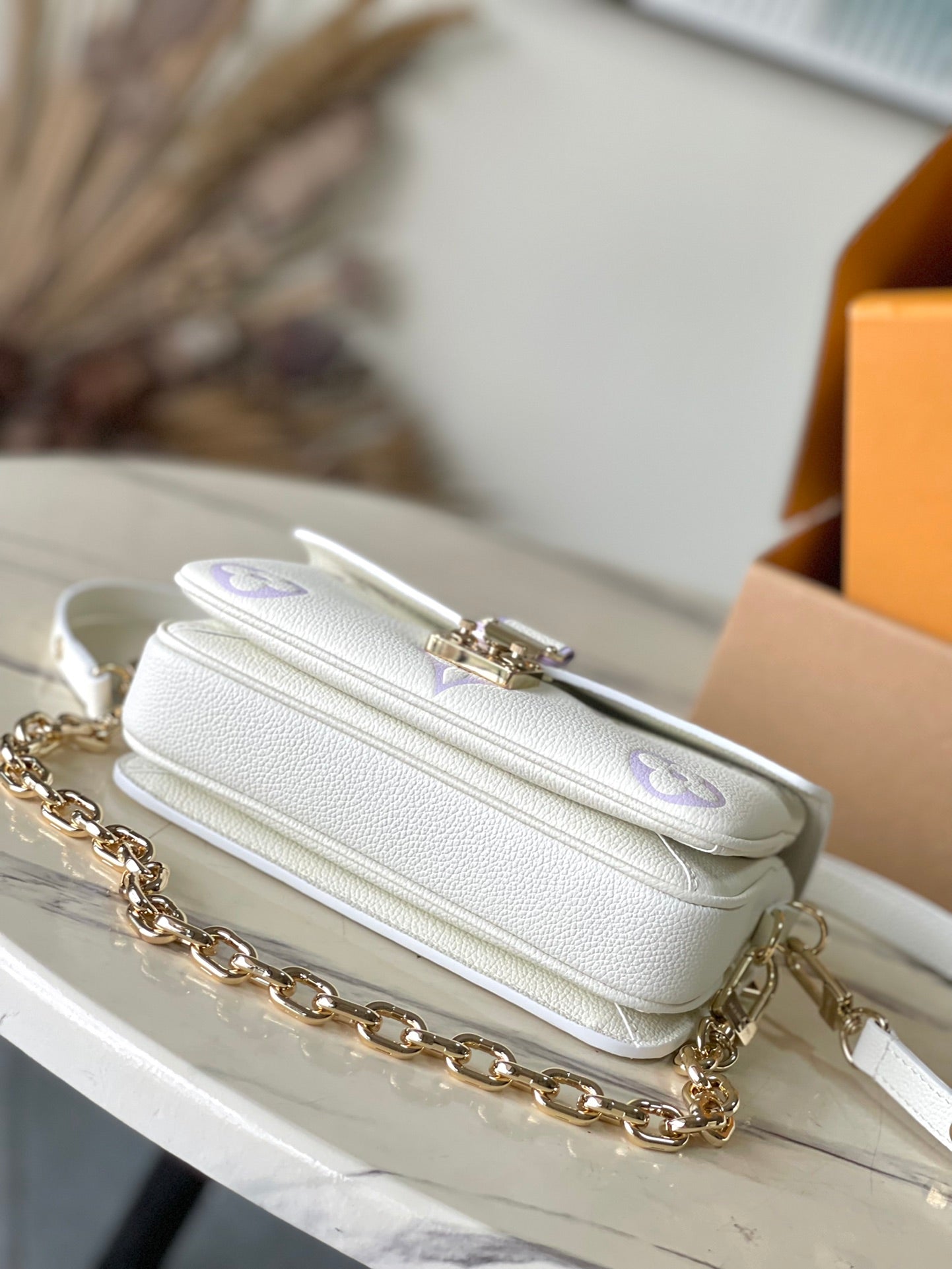 LOUIS VUITTON POCHETTE METIS EAST WEST 21 IN WHITE PURPLE MONOGRAM EMPREINTE LEATHER