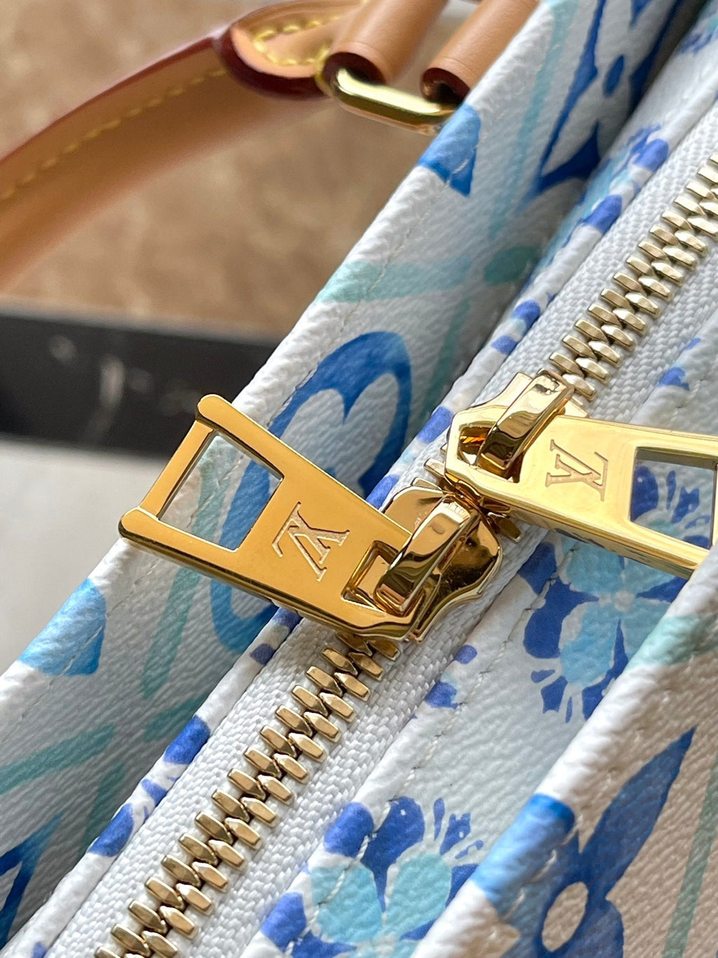 LOUIS VUITTON ONTHEGO EAST WEST 25 IN LAGOON BLUE MONOGRAM TILES CANVAS
