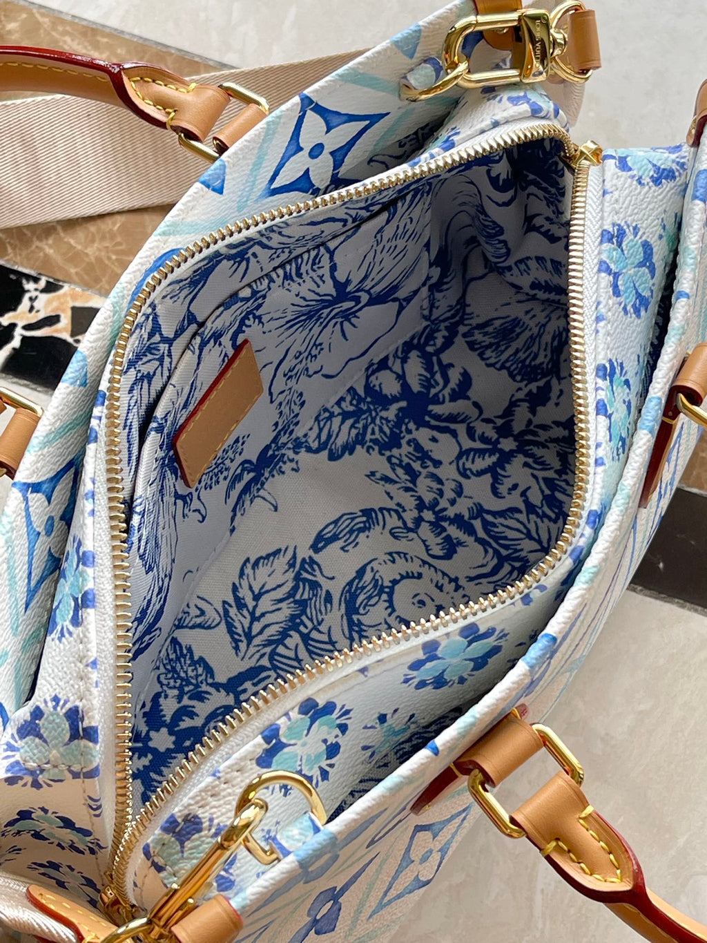 LOUIS VUITTON ONTHEGO EAST WEST 25 IN LAGOON BLUE MONOGRAM TILES CANVAS